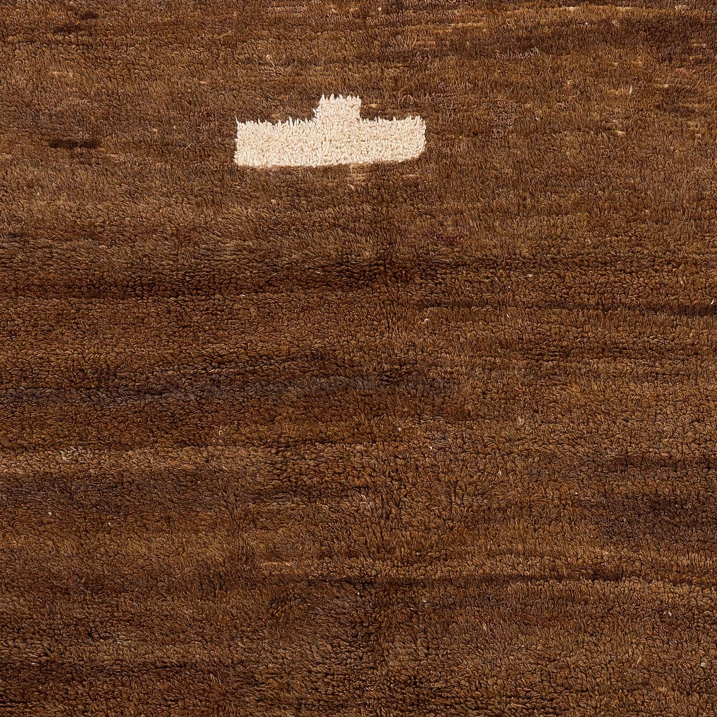 Transform your space with the understated luxury of our Moroccan-style hand-knotted Tulu rug, inspired by the heritage-rich designs of the Beni Ourain tribes. This rug is a celebration of craftsmanship and tradition, entirely handmade by skilled