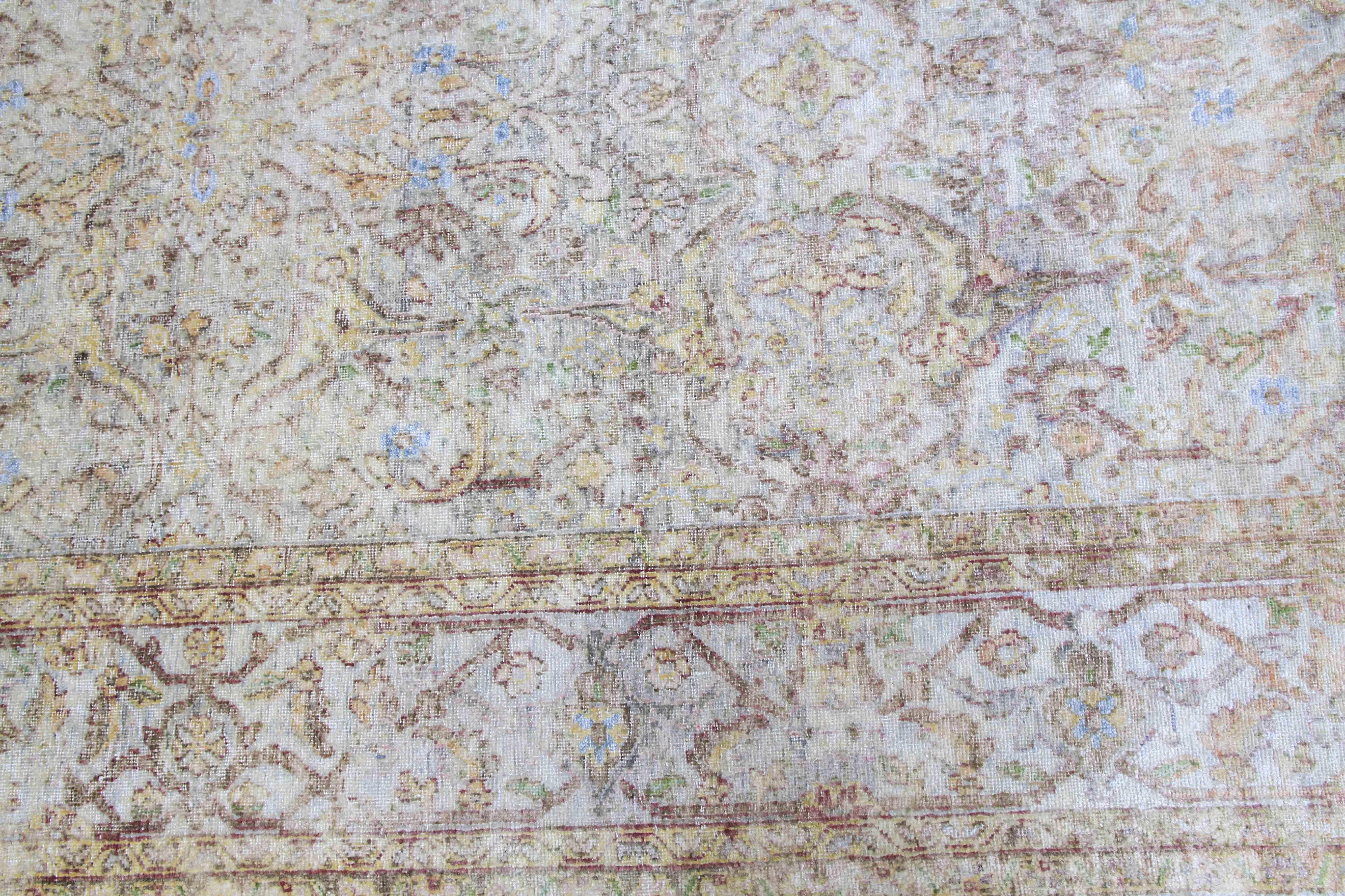 This distressed silk rug transforms the vintage style into a delicate modern look. The rug is transformed by artisans through a series of washing, sunning, and shearing - making iconic Persian motifs into a subtle tone-on-tone silk fabric feeling. 
