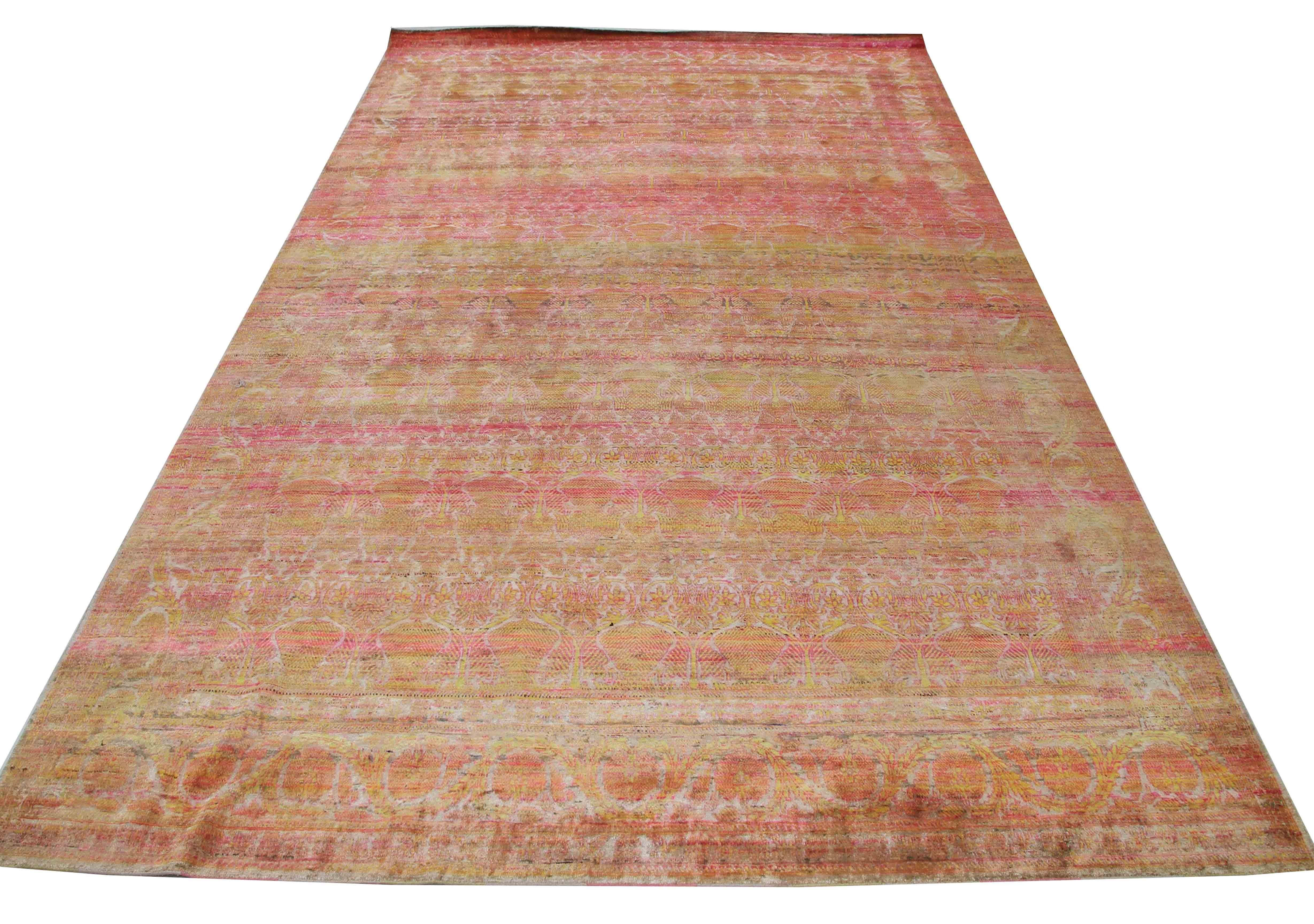 This hand-knotted silk rug is a one-of-a-kind masterpiece that measures 9'9'' x 14'. Hand-knotted in Jaipur, India, this rug is made from recycled silk saris, transforming antique motifs into a field of lively colors. The combination of traditional