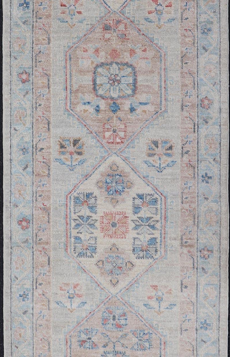 Afghan Hand-Knotted Oushak Runner with Medallion Design On A Cream Field With Blues For Sale