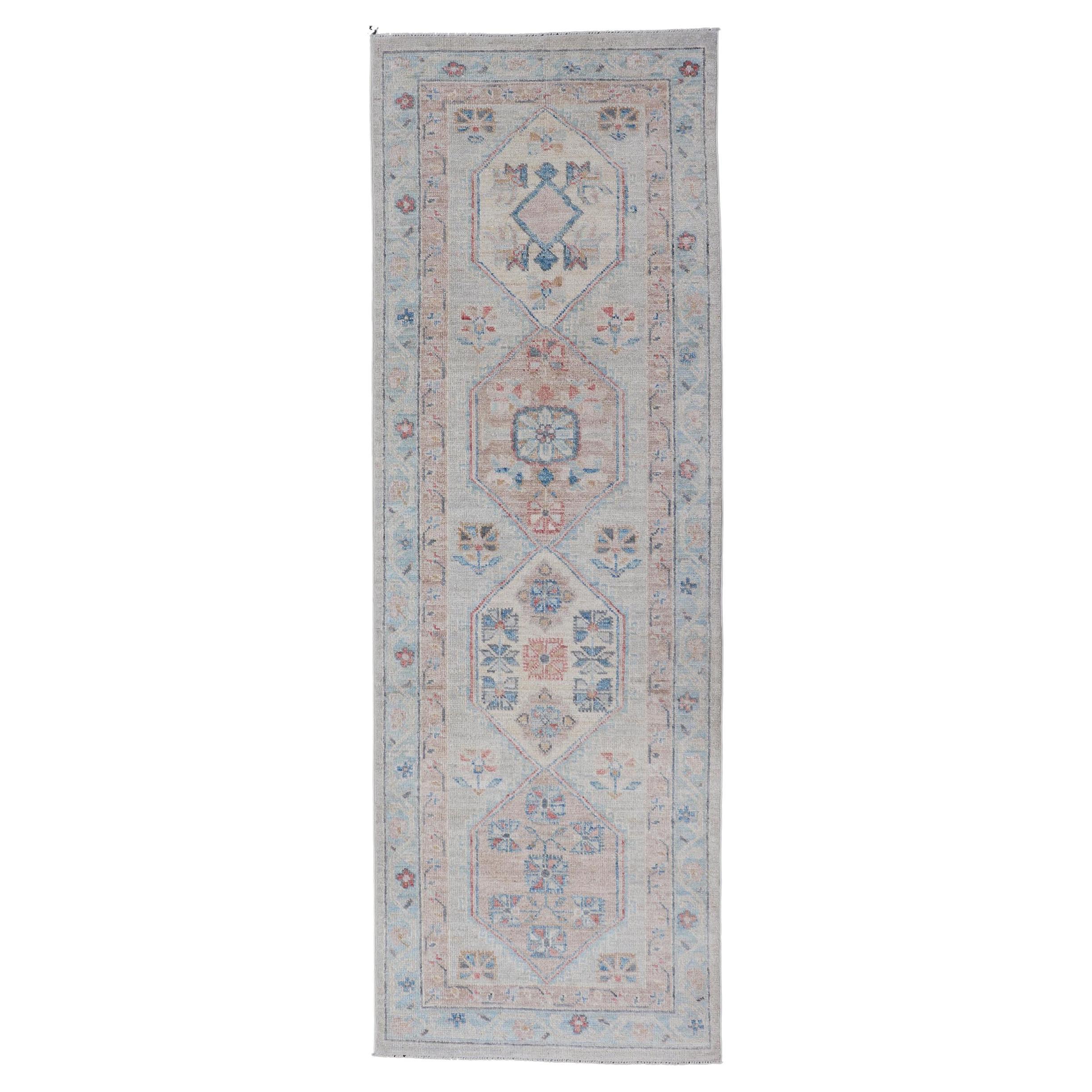 Hand-Knotted Oushak Runner with Medallion Design On A Cream Field With Blues For Sale