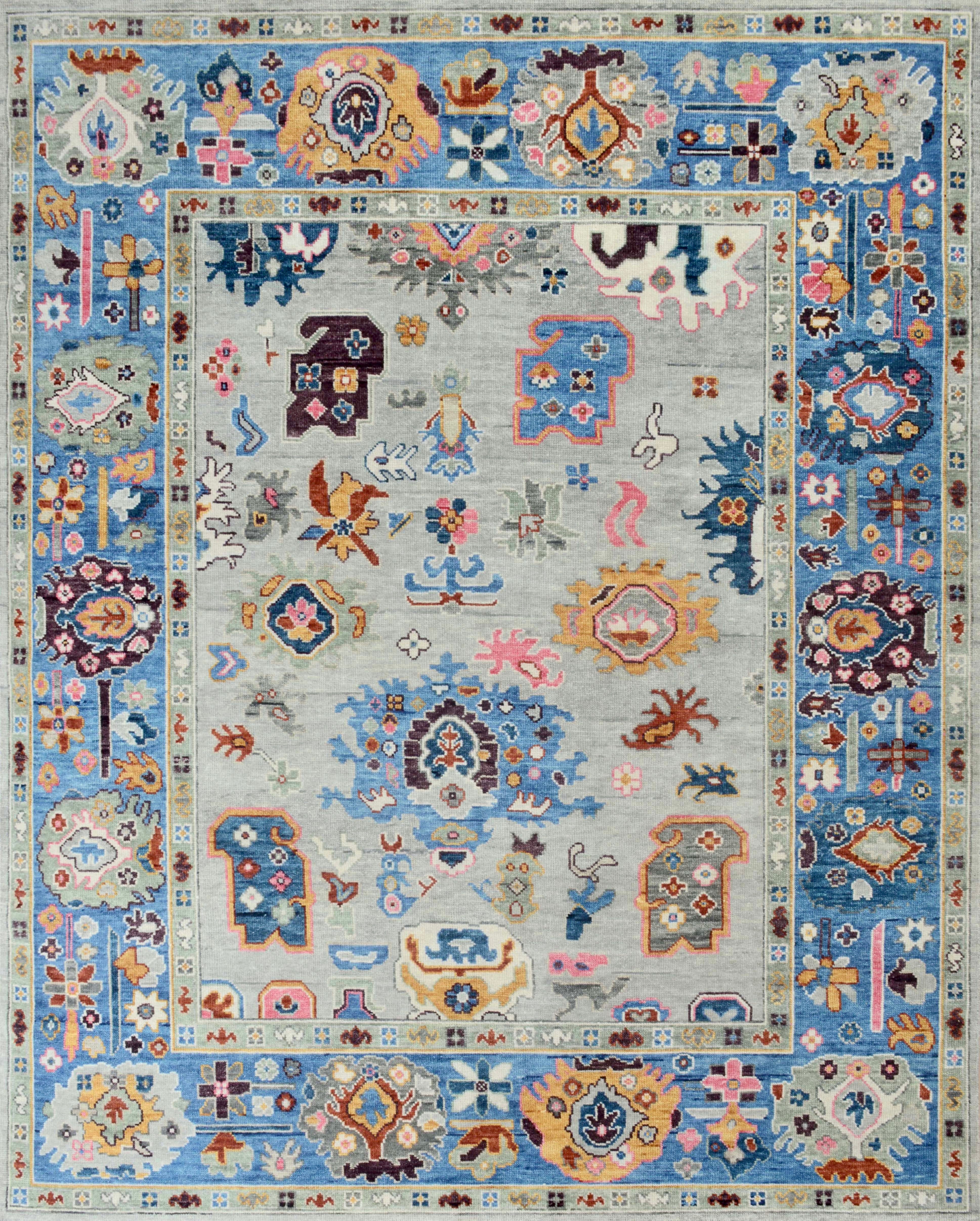 Hand-Knotted Oushak Style Wool Rug in Light Blue, Ivory and Multi-Color Accents For Sale