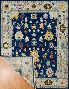 Hand-Knotted Oushak Style Wool Rug in Navy Blue, Ivory and Multi-Color Accents