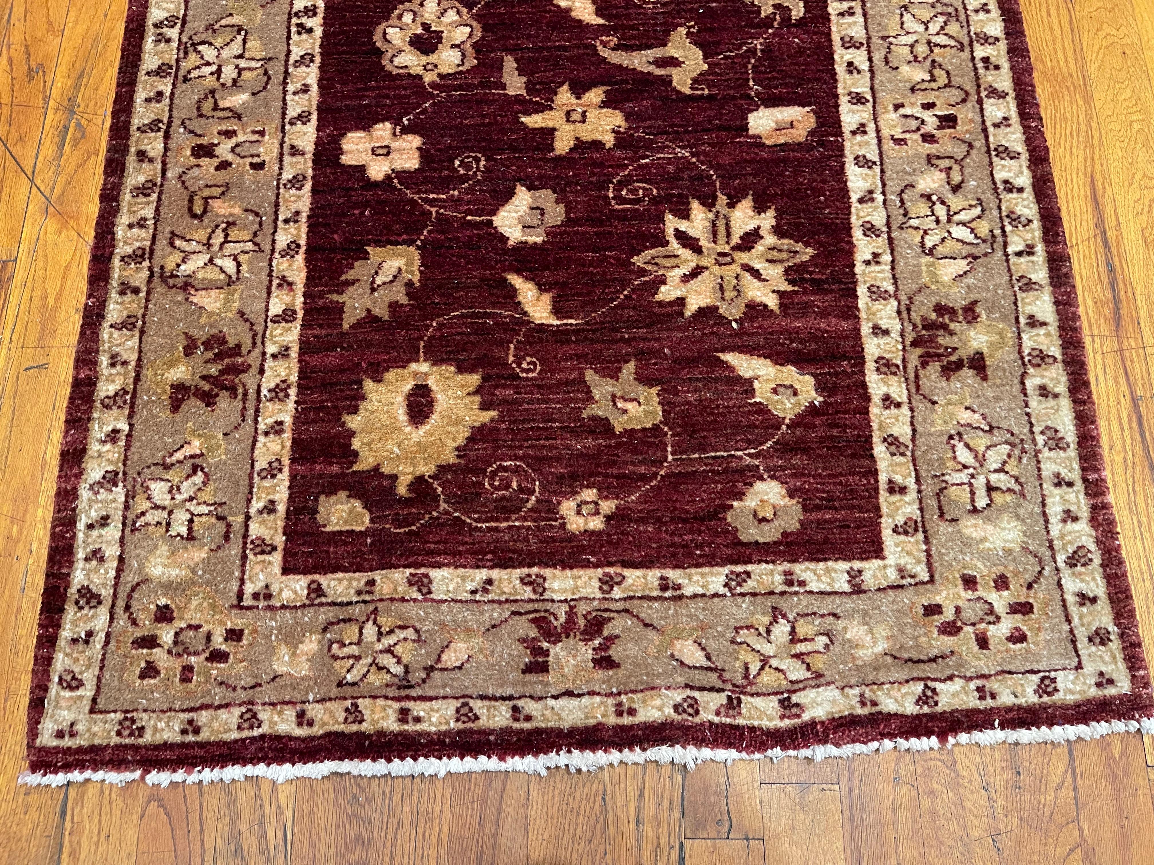
This Pakistan rug is a hand knotted with a wool pile and cotton weft. The base color is rich burgundy and the border is beige. The Pakistan rugs are in high demand across the market because their design, quality and color combination. Measuring 2