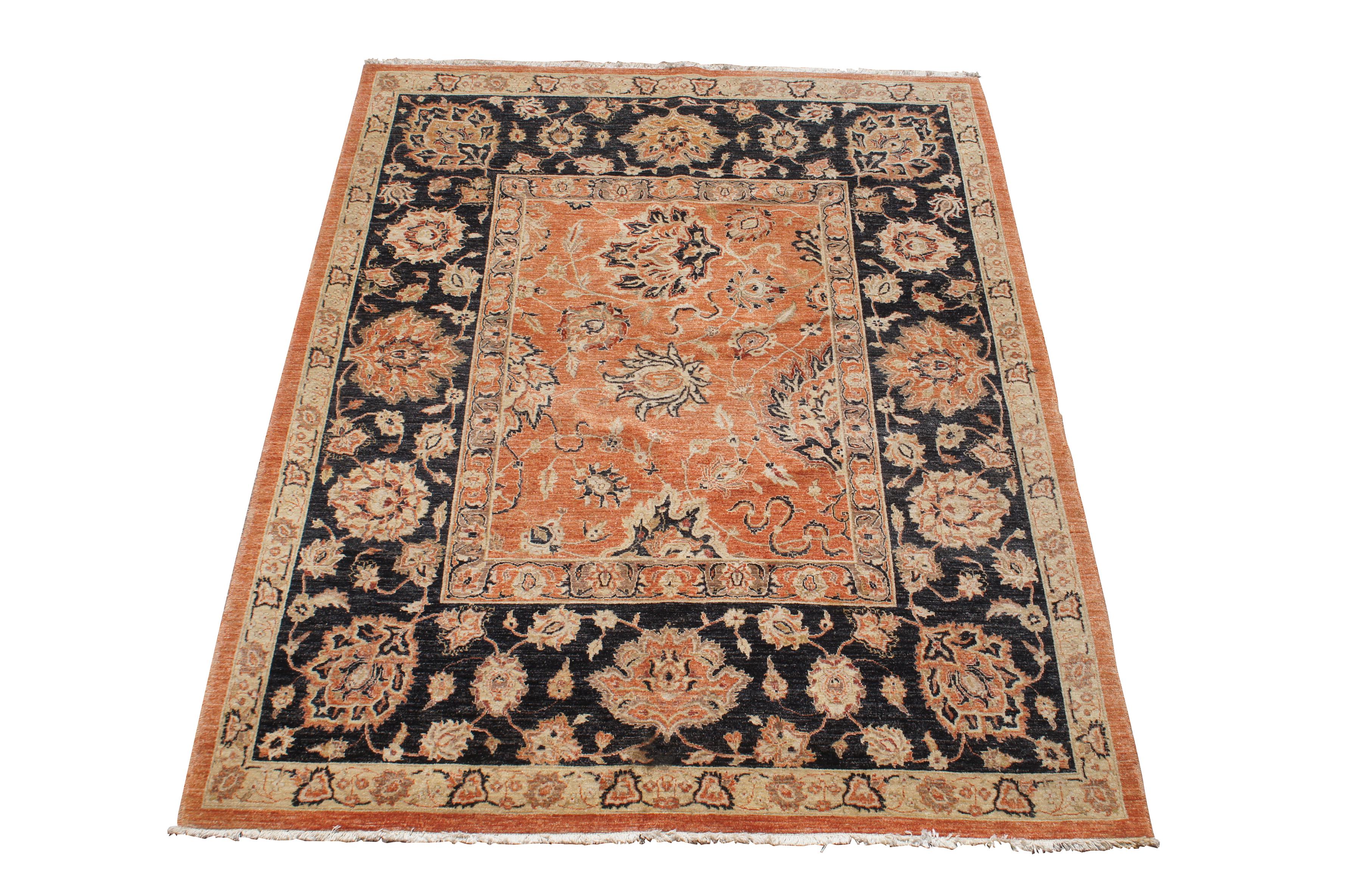 Exceptional hand knotted oriental area rug.  Features a floral pattern with large sprays in orange, beige and very dark blue/ black

Peshawar rugs are handmade rugs from northwestern Pakistan that feature traditional Persian and Turkish Oushak style
