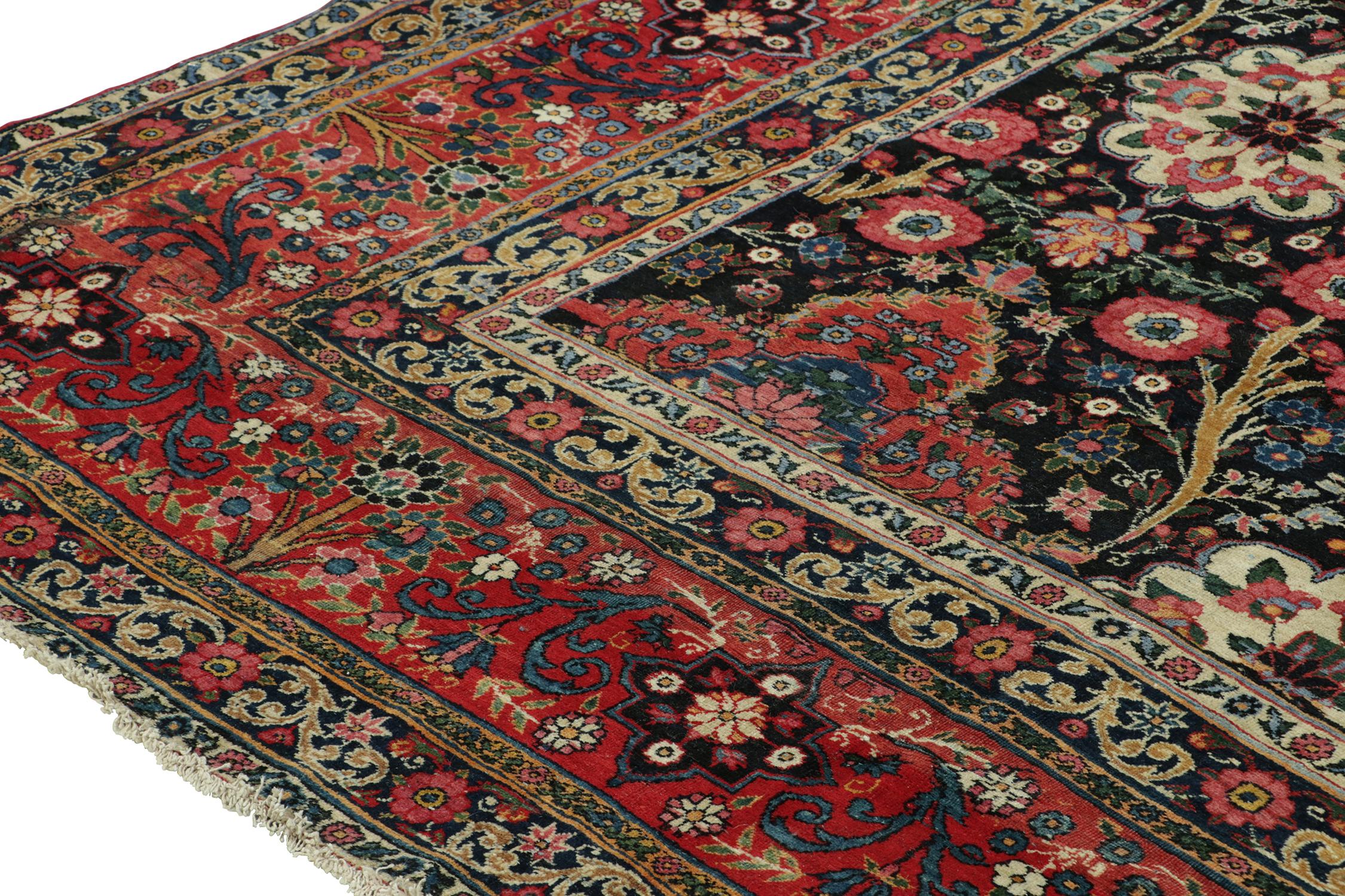 Antique Persian Rug in Black with Red Floral Patterns - by Rug & Kilim In Good Condition For Sale In Long Island City, NY