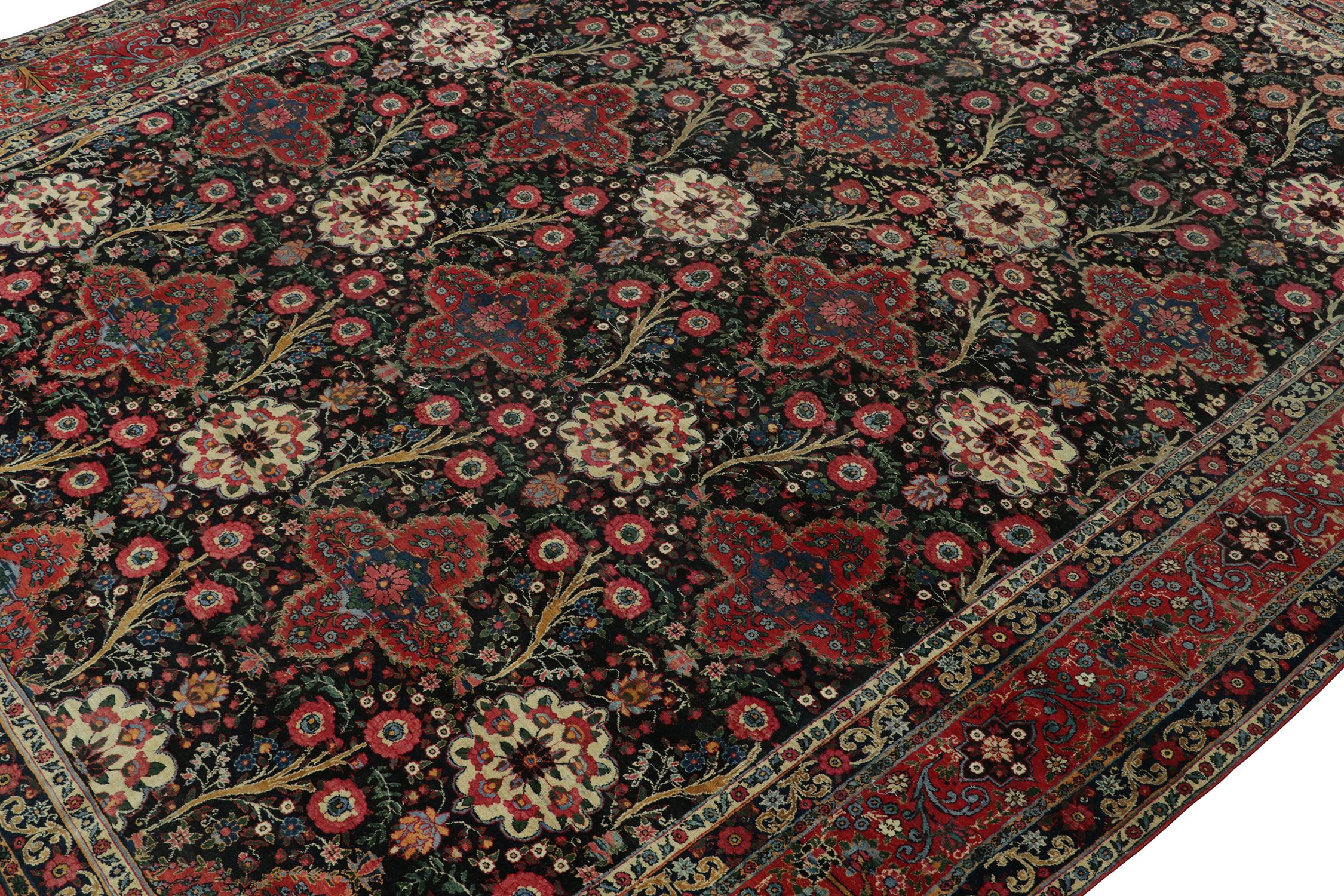 Hand-Knotted Antique Persian Rug in Black with Red Floral Patterns - by Rug & Kilim For Sale