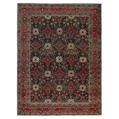 Antiker persischer Teppich in Schwarz mit roten Blumenmuster von Teppich & Kilim