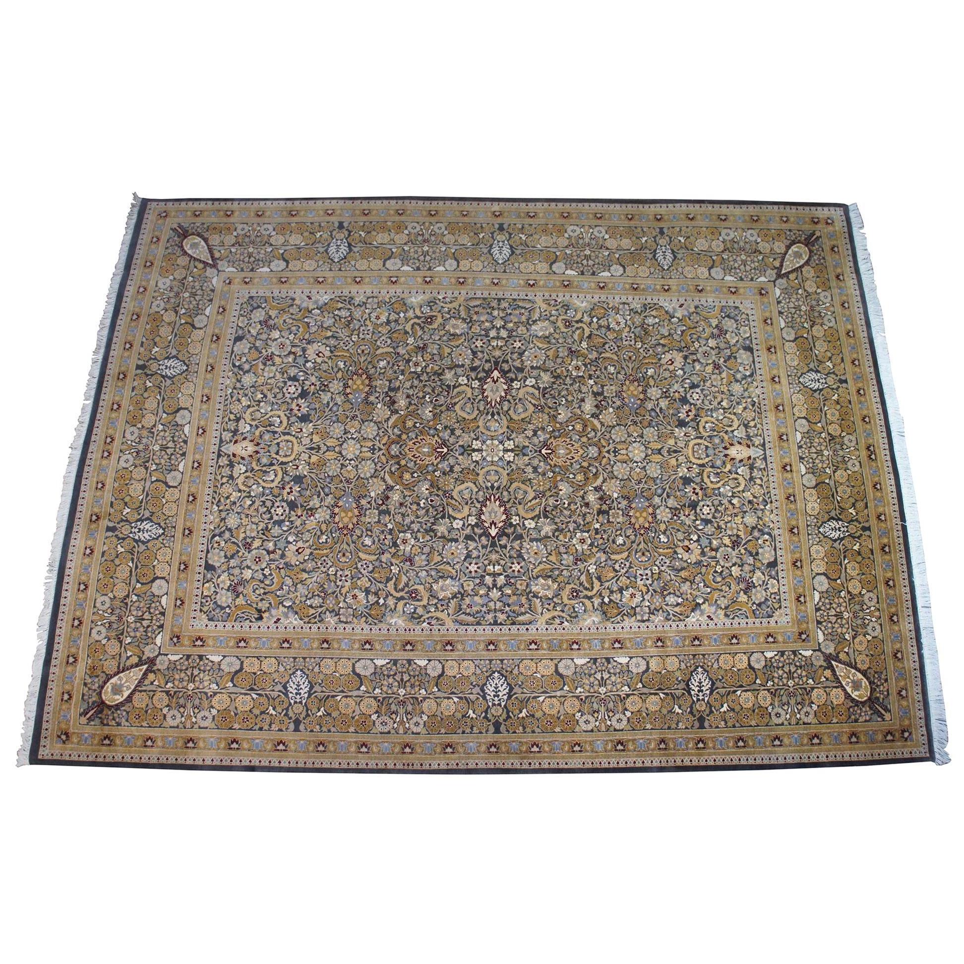 Vintage Indian Jaipur silk and wool rectangular area rug featuring a floral motif throughout a field of gray with beige / tan, reds, blues, gold and green. Measures: 9