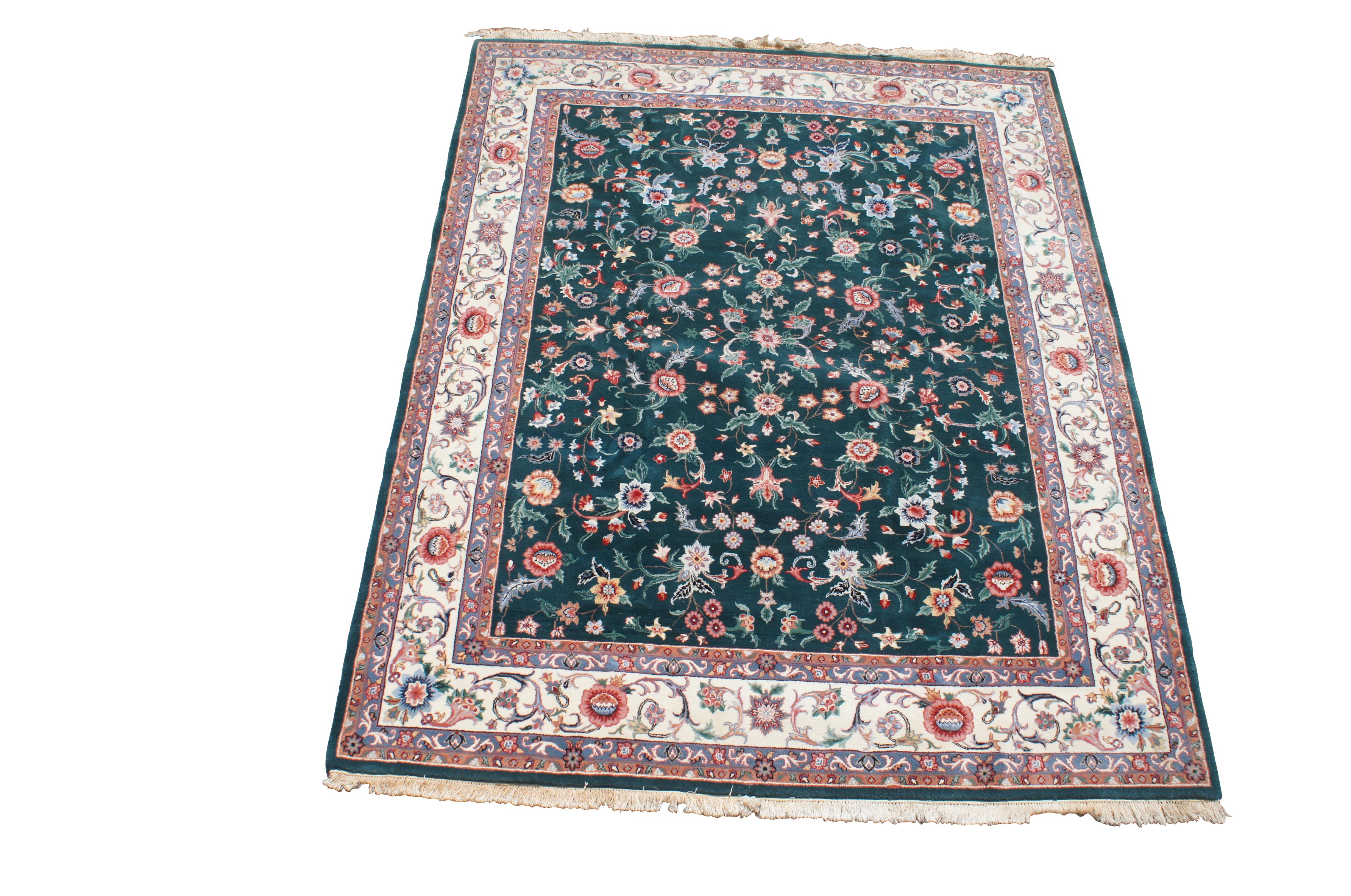 Vintage Teal & Ivory floral all over rug. Features a vibrant design with shades of green, blue, red and salmon.  144 knots per square inch.

Sino Tabriz rugs are known for their high quality weave and adherence to traditional Persian rug design.
