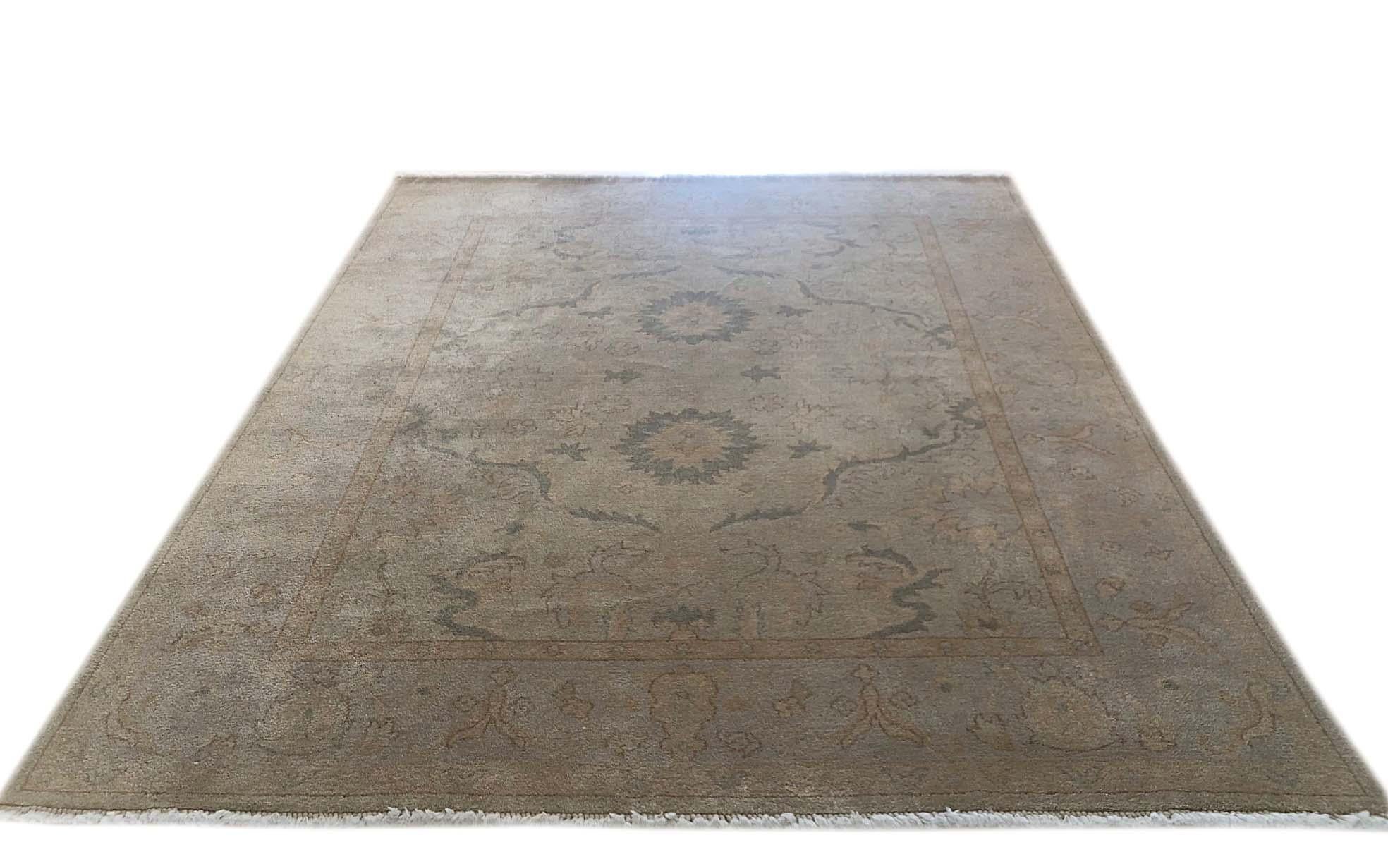 Hand knotted Indian rug with wool pile and cotton foundation. This design of this piece has been inspired by well-known Persian rugs Sultanabad design in the 19th century . The base and border color is ice blue.