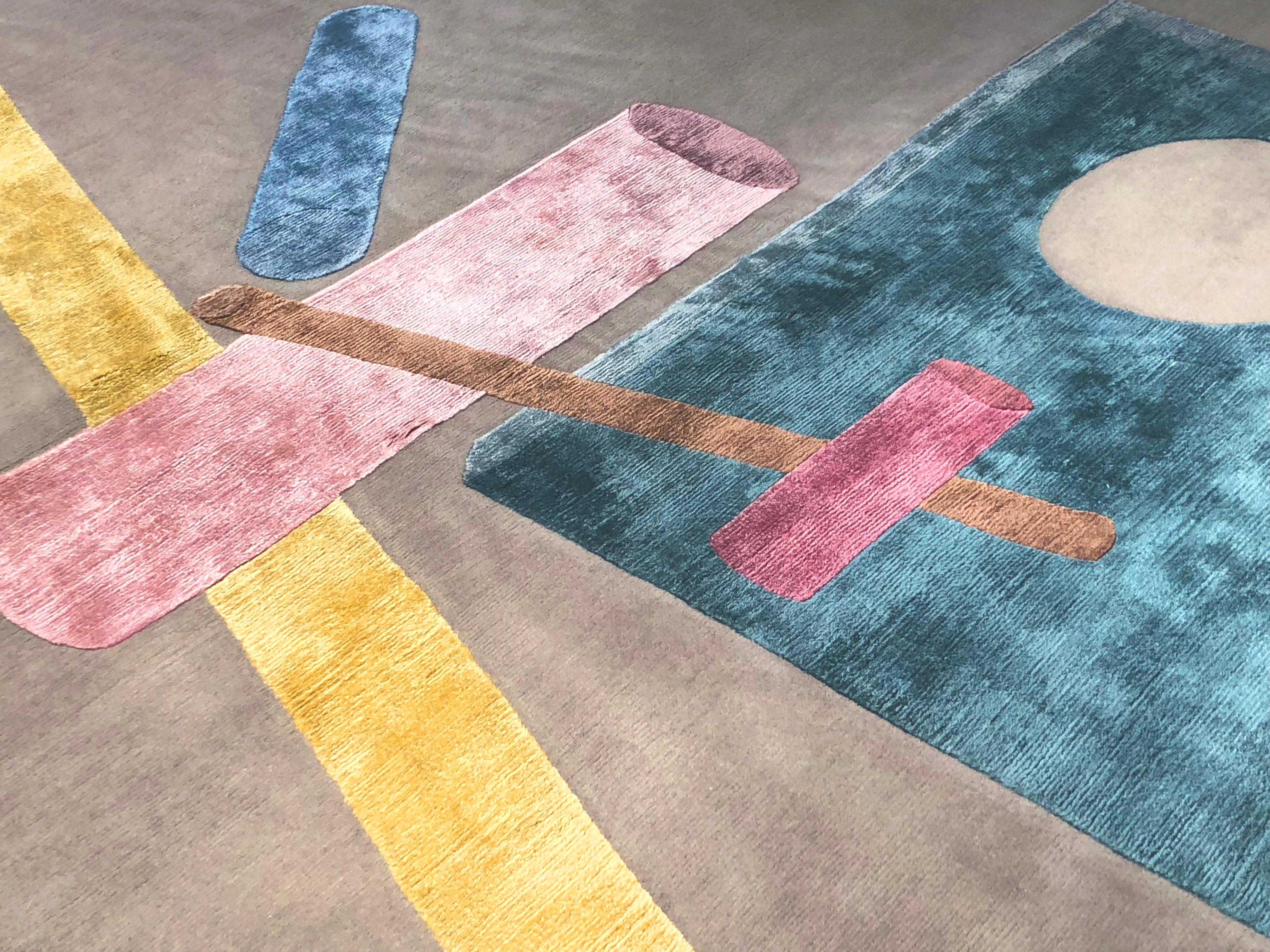 Designed by Fabien Cappello presents a composition of 3D elements translated into a graphical game of forms and shadows. The surface magically acquires volume thanks to forms and colors that create vibrant spatial depth.
This rug is hand knotted in