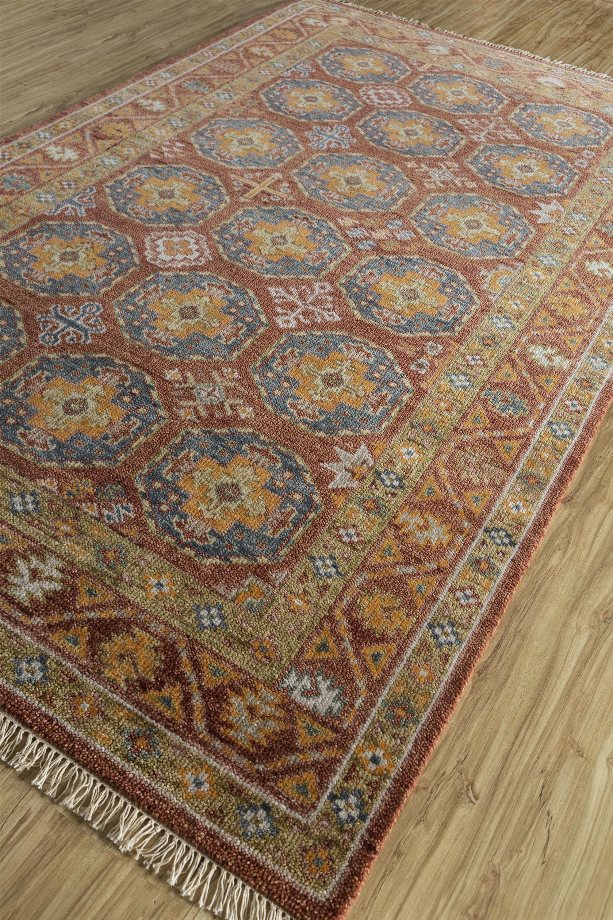 Elevate your decor with this 6' x 9' Jaipur hand-knotted wool rug in striking Navajo red and deep blue tones. Inspired by traditional Southwestern motifs, the rug features a bold, intricate pattern that adds warmth and character to any space.