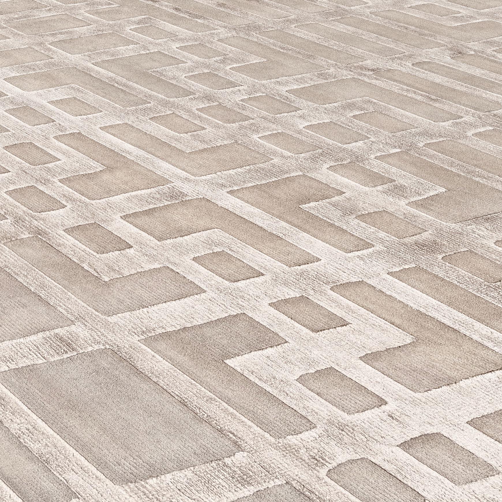 The simplicity of the shapes make Oracle a rug of timeless charm and elegance. 
This rug is hand knotted in Nepal by our artisans by using 50% silk and 50% fine Himalayan wool dyed using vegetable and mineral pigments. The base is 5 mm high, while