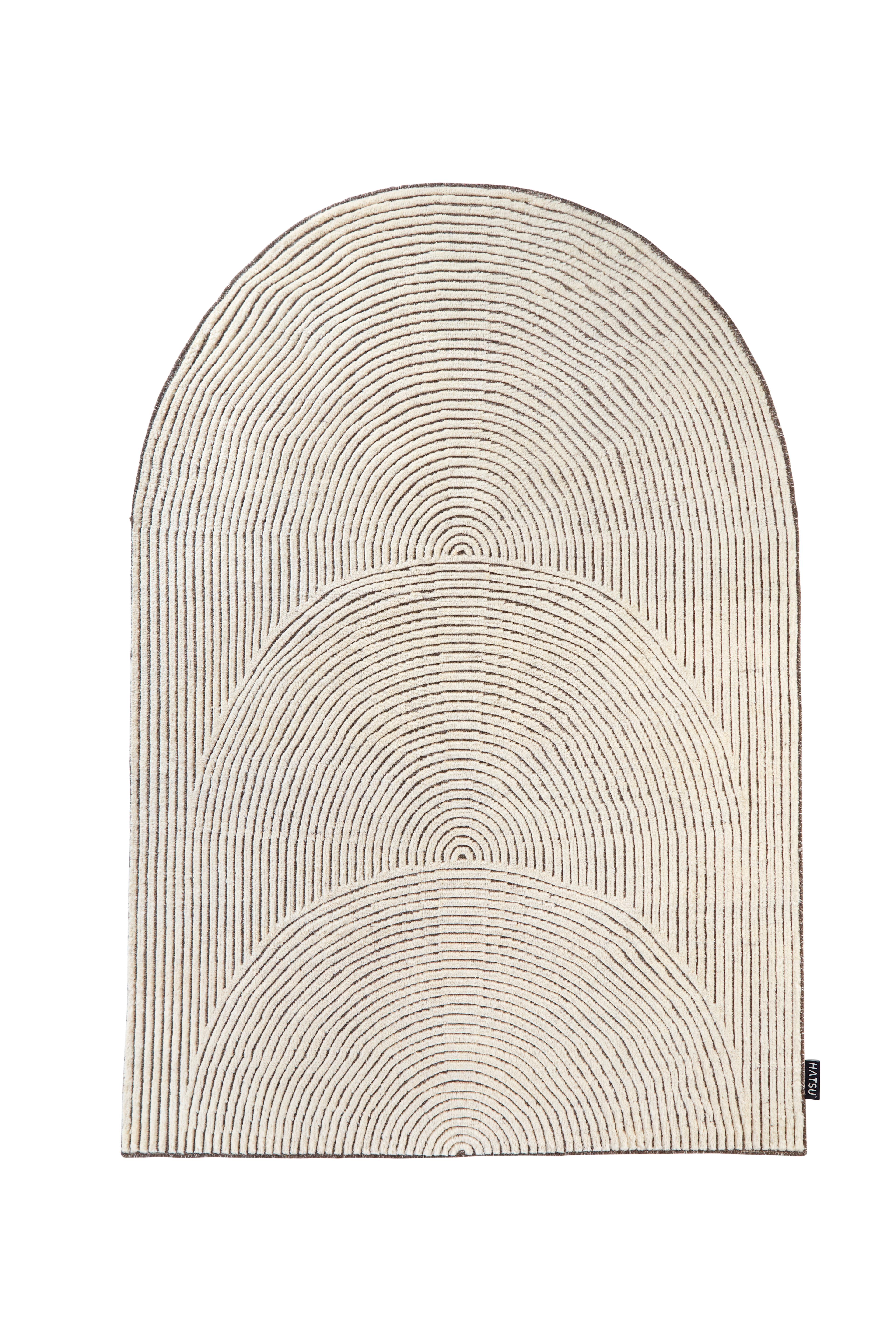 Hand knotted semicircle rug by Hatsu
Dimensions: D 222 x W 152 cm 
Materials: Wool

Hatsu is a design studio based in Mumbai that creates modern lighting that are unique and immediately recognisable. We started with an idea to make good design