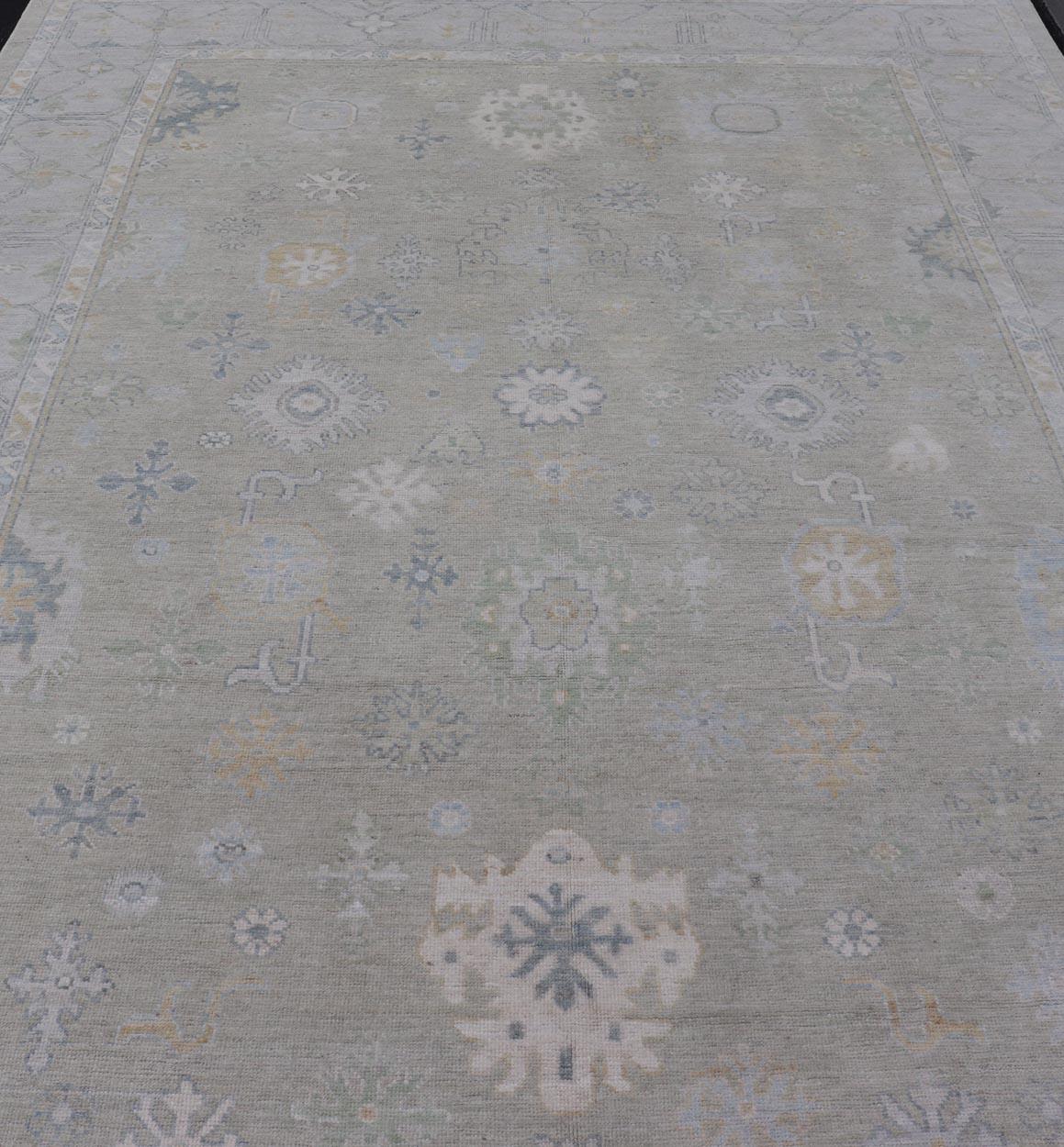 Hand-Knotted Modern Neutral Oushak Rug in Light Gray, Light Blue, Green. Keivan Woven Arts; rug AWR-16020 / Country of Origin: Afghanistan Type: Oushak Design: All-Over, Floral
Measures: 10.3 x 14.3 
This rustic piece holds charm within a powder