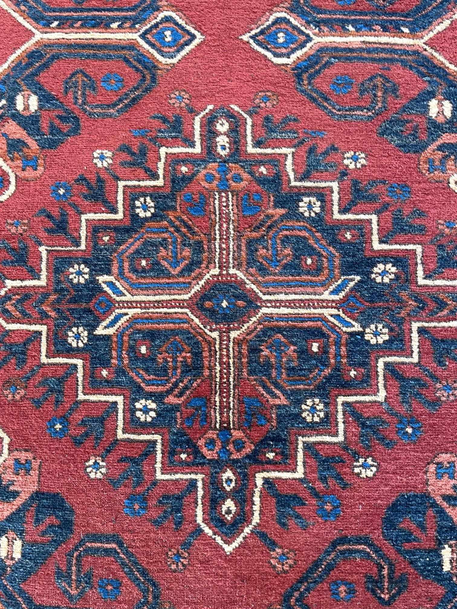 Hand Knotted Tribal Repeated Medallion Rust Blue Afghan Rug 1990 Circa In Good Condition For Sale In San Diego, CA