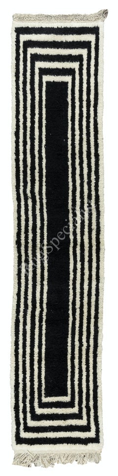 Alfombra Tulu hecha a mano con lana negra y crema. Opciones personalizadas disponibles
