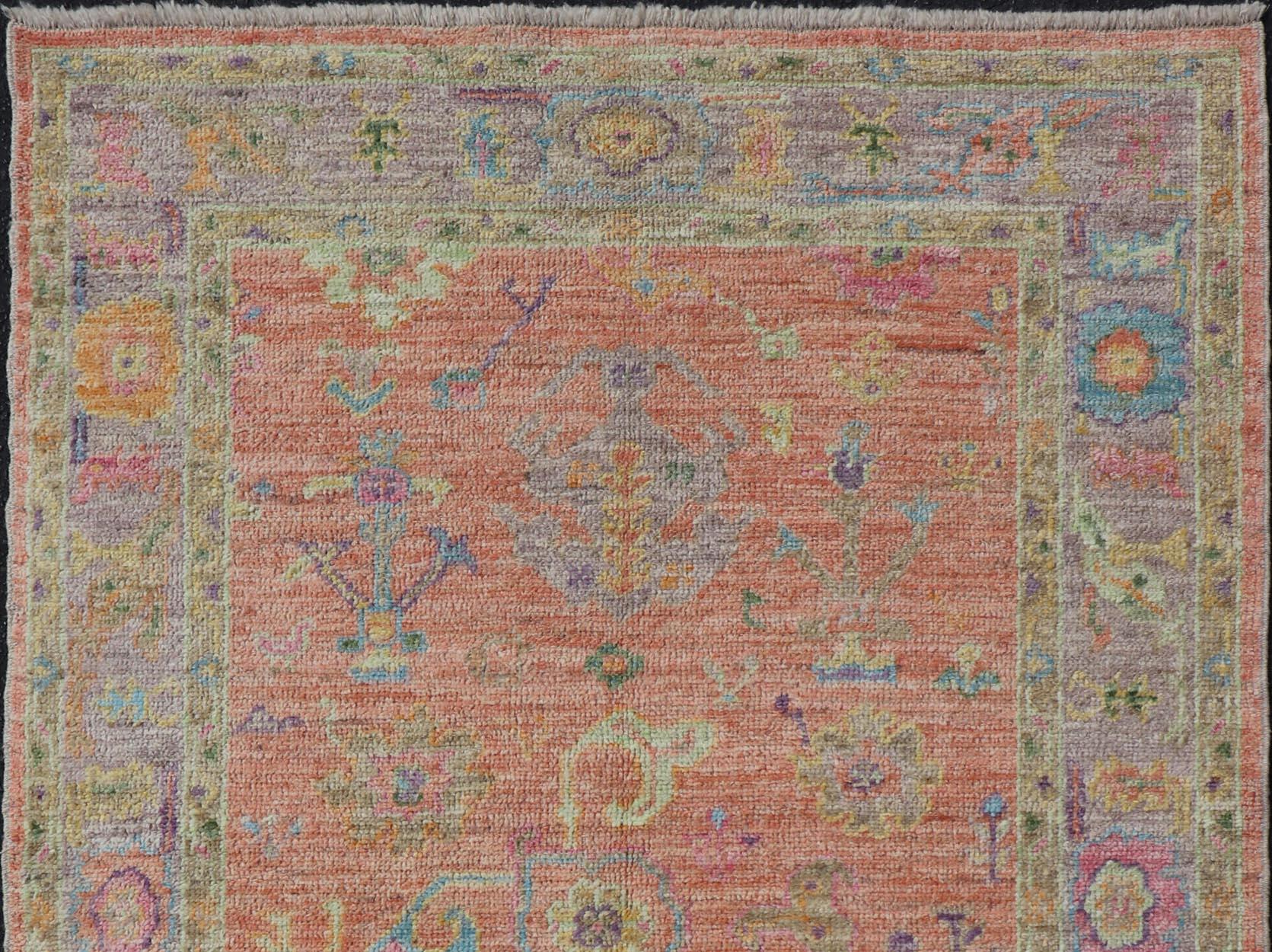 Hand-Knotted Hand Knotted Turkish Floral Oushak with Orange Background and Lilac Border  For Sale