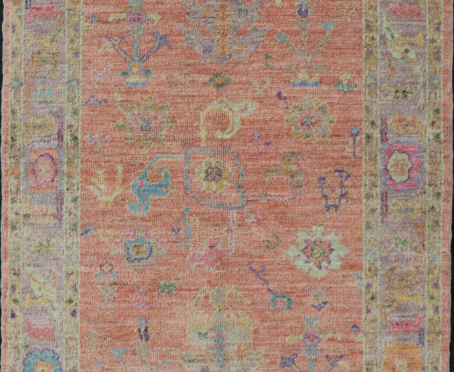 Hand Knotted Turkish Floral Oushak with Orange Background and Lilac Border  In New Condition For Sale In Atlanta, GA