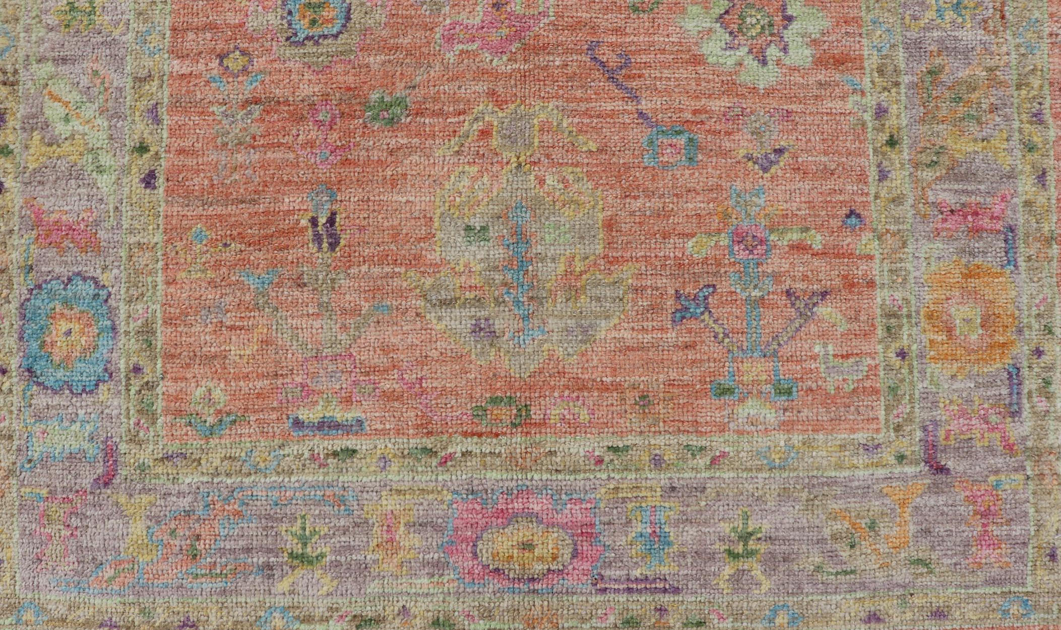 Wool Hand Knotted Turkish Floral Oushak with Orange Background and Lilac Border  For Sale