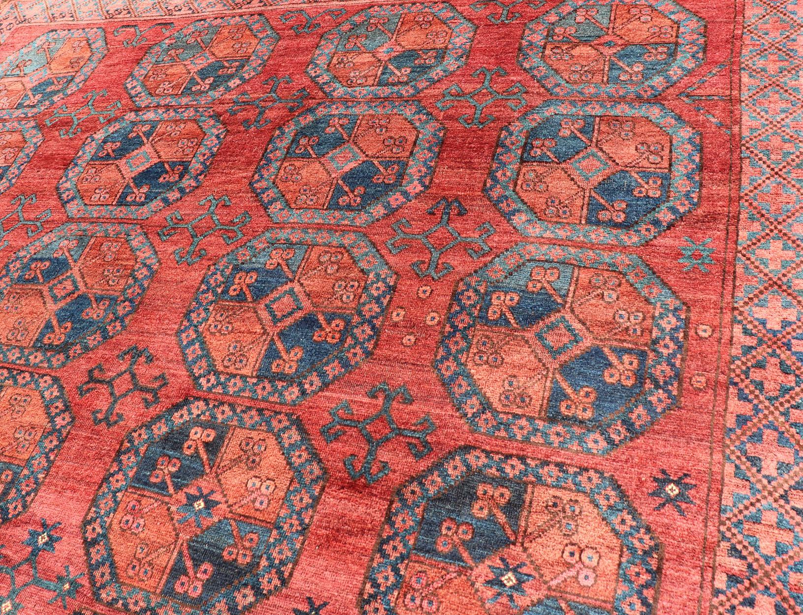 Islamic Hand-Knotted Turkomen Ersari Rug in Wool with Gul Design in Red, Orange and Blue For Sale