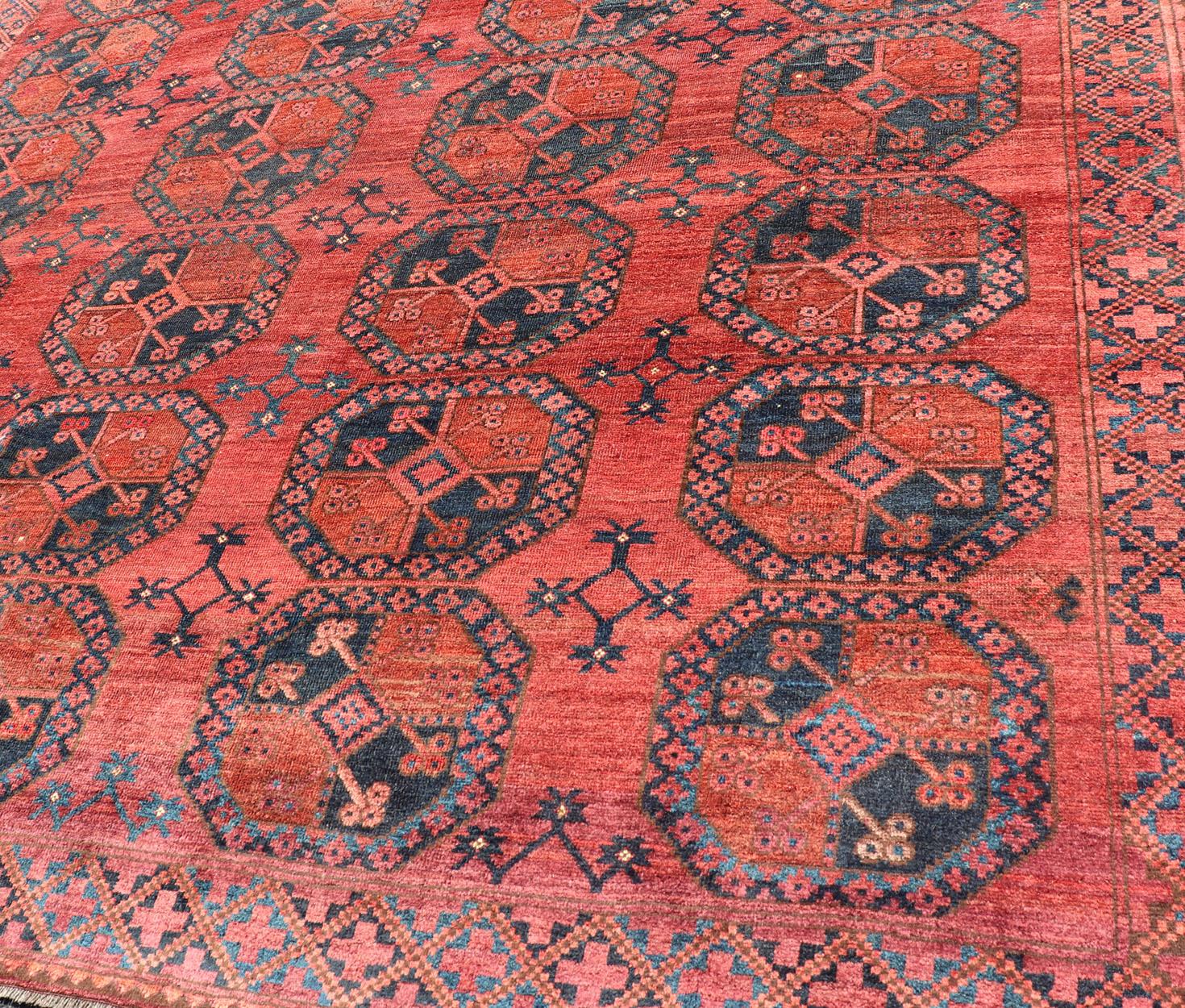 Turkestan Hand-Knotted Turkomen Ersari Rug in Wool with Gul Design in Red, Orange and Blue For Sale