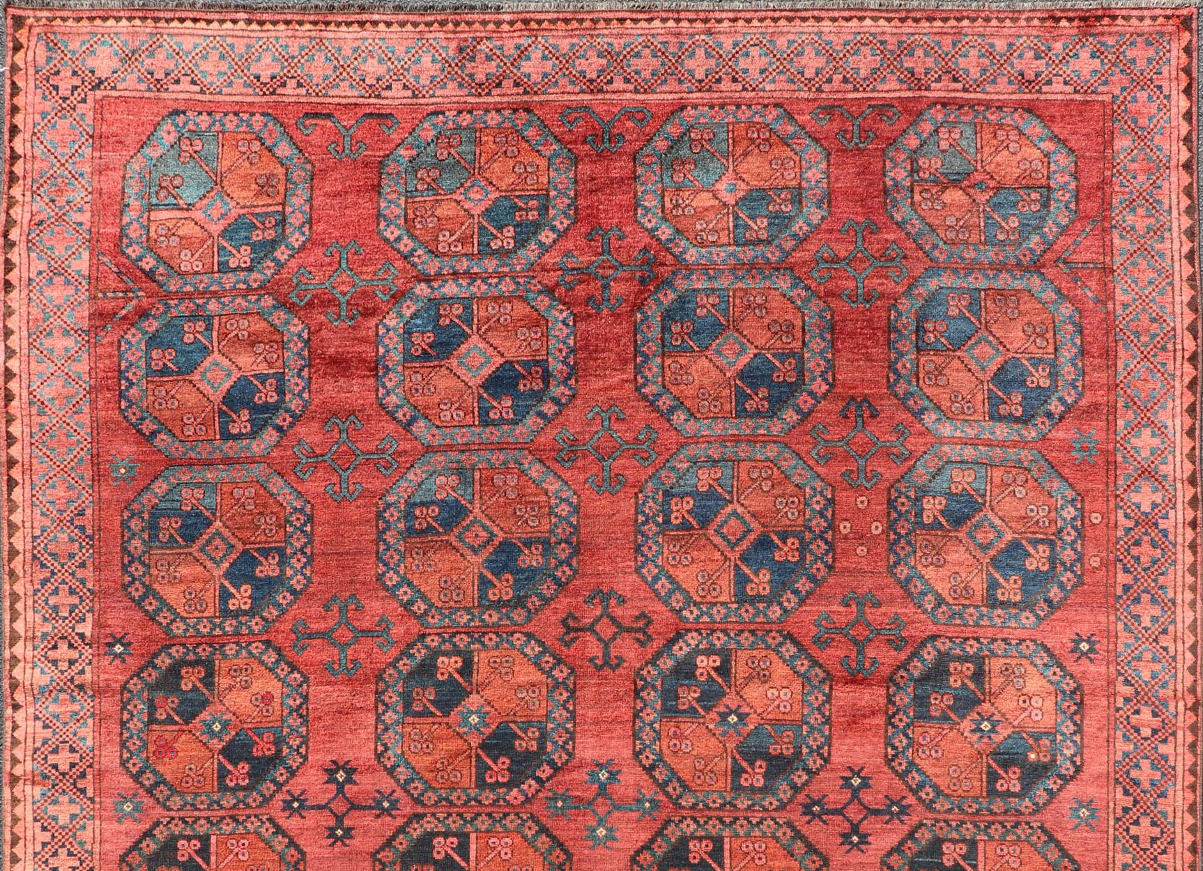 Tappeto Turkomen Ersari in lana, annodato a mano, con disegno Gul in rosso, arancione e blu. In condizioni buone in vendita a Atlanta, GA