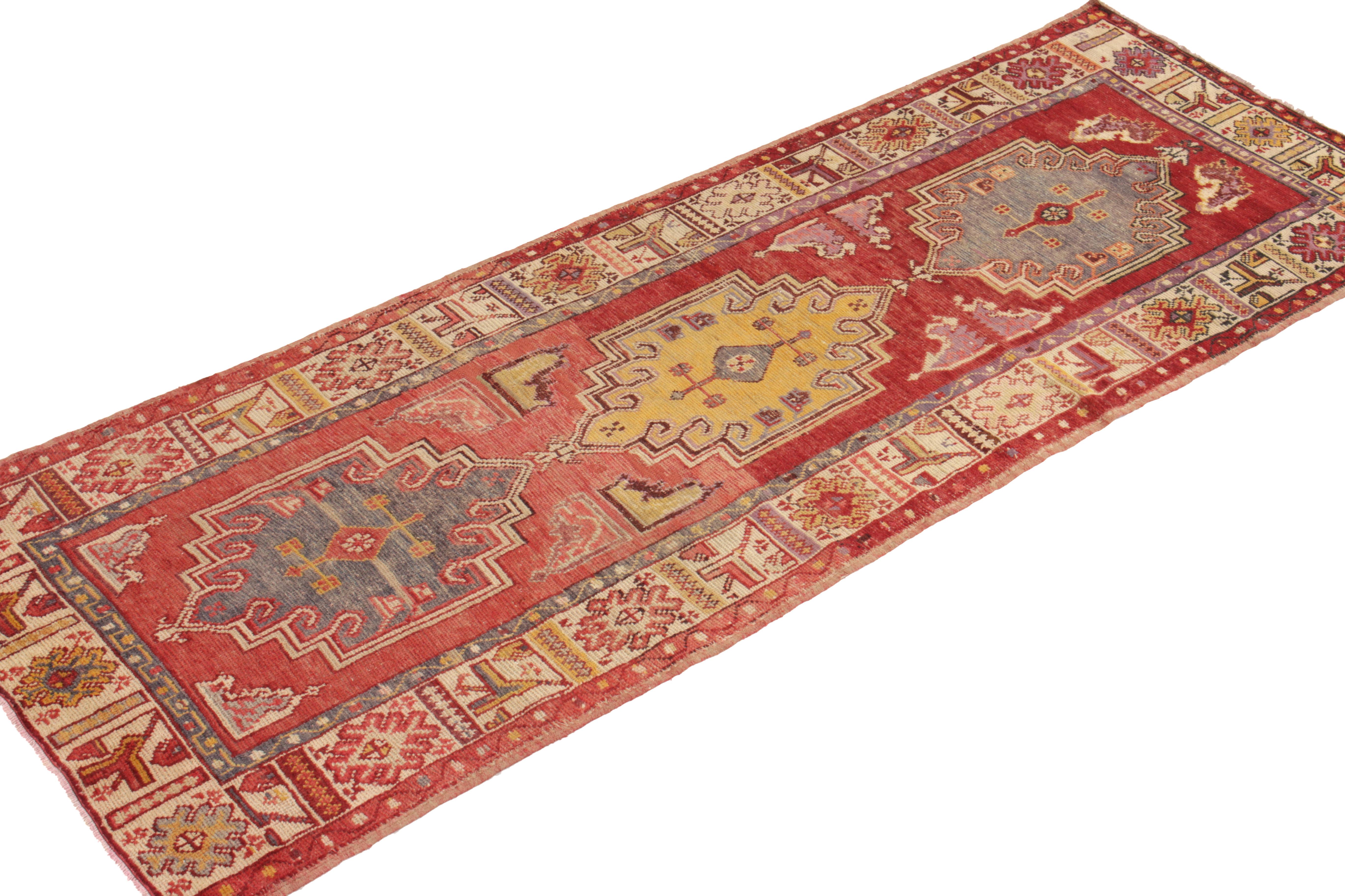 Turkish Hand-Knotted Vintage Anatolian Runner in Red Medallion Pattern by Rug & Kilim For Sale
