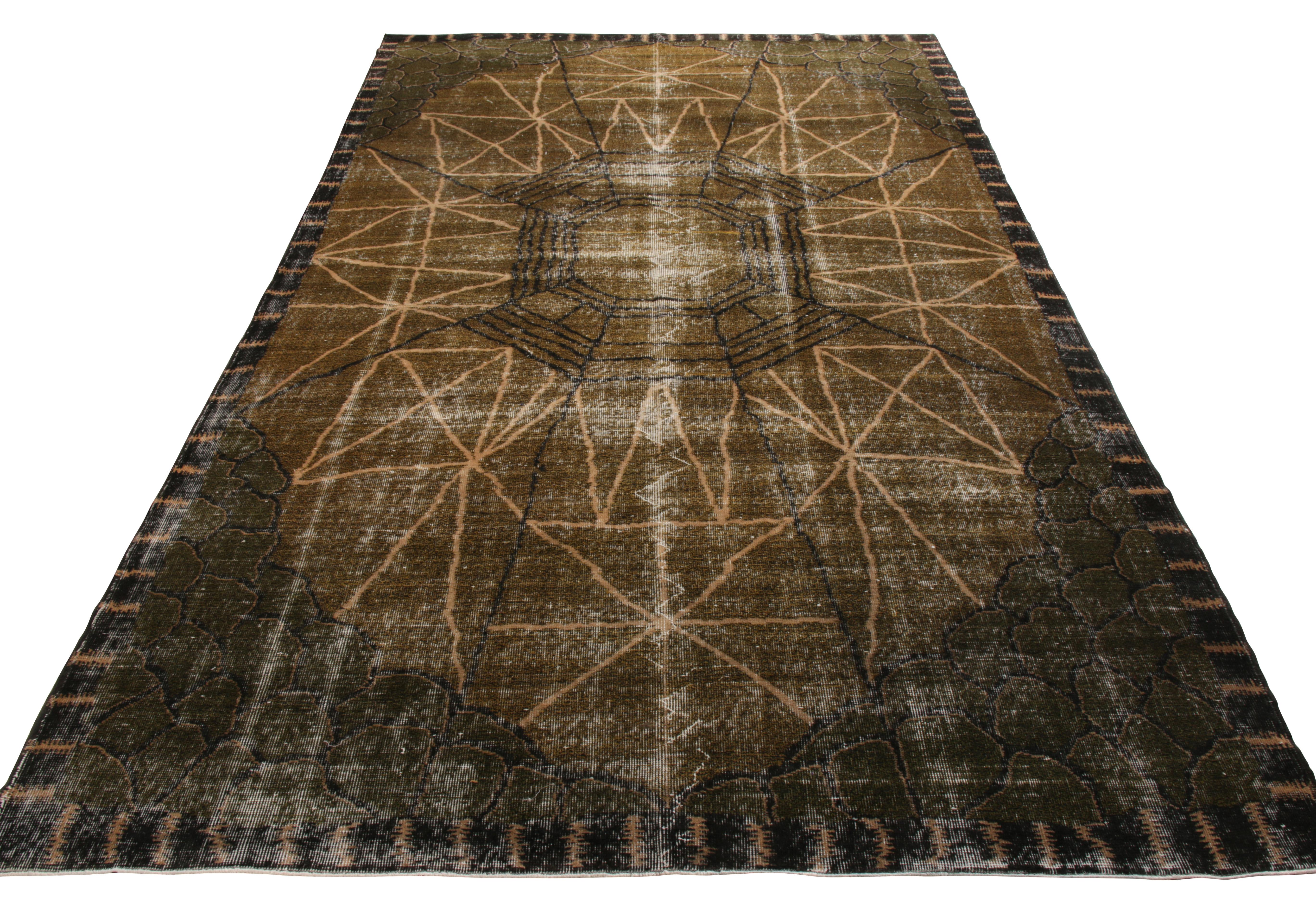 Hand knotted in wool originating from Turkey circa 1960-1970, a vintage 7x11 Art Deco rug from our mid century Pasha Collection. Celebrating the discerning works of Zeki Müren in an all over geometric pattern, this classic piece creates a pleasing