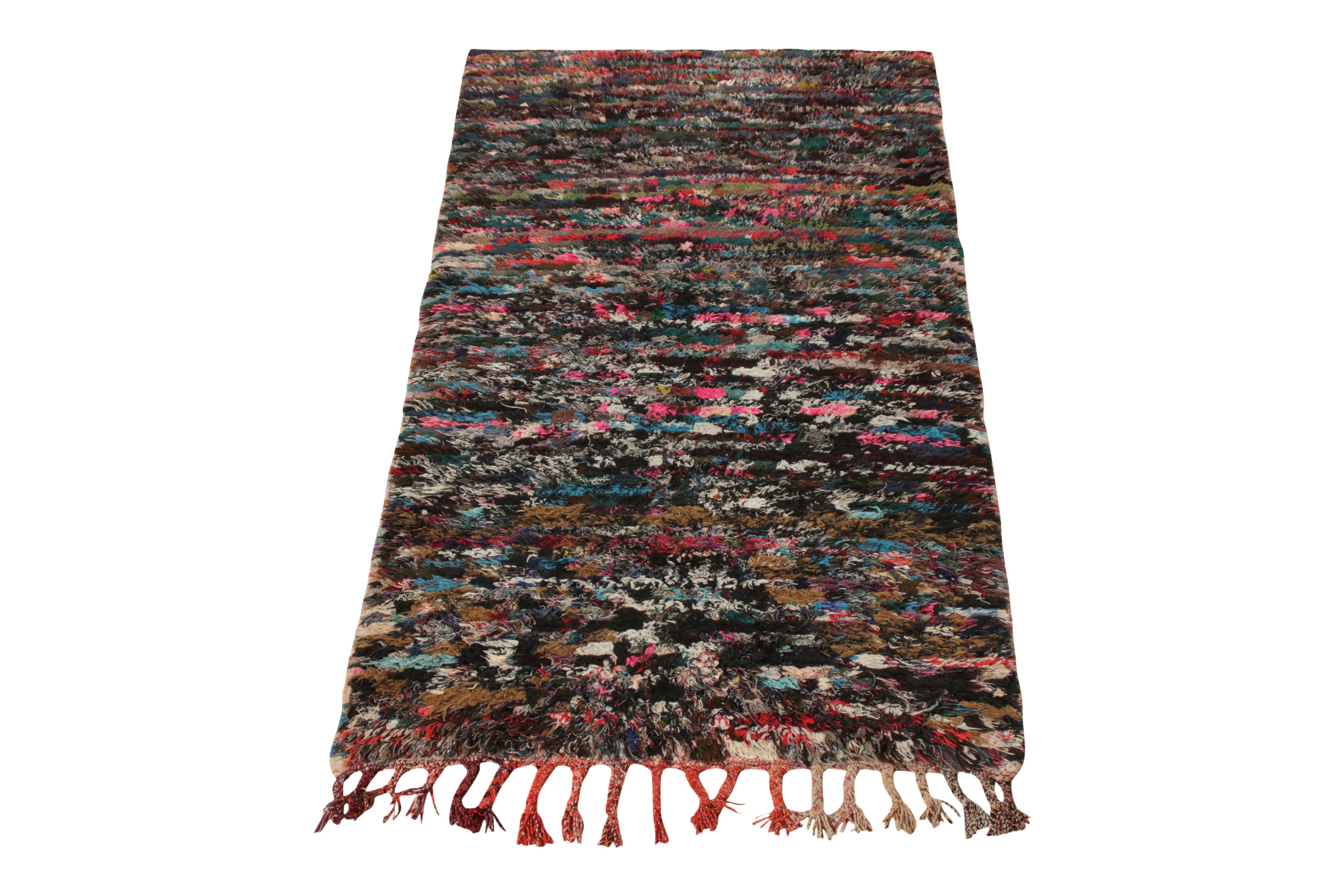 Hand knotted in wool originating from Morocco circa 1950-1960, this 3x5 vintage Boucherite piece from Rug & Kilim’s Moroccan Collection enjoys a tasteful textural sensibility along with a multicolour striation across the scale. Dominating shades of