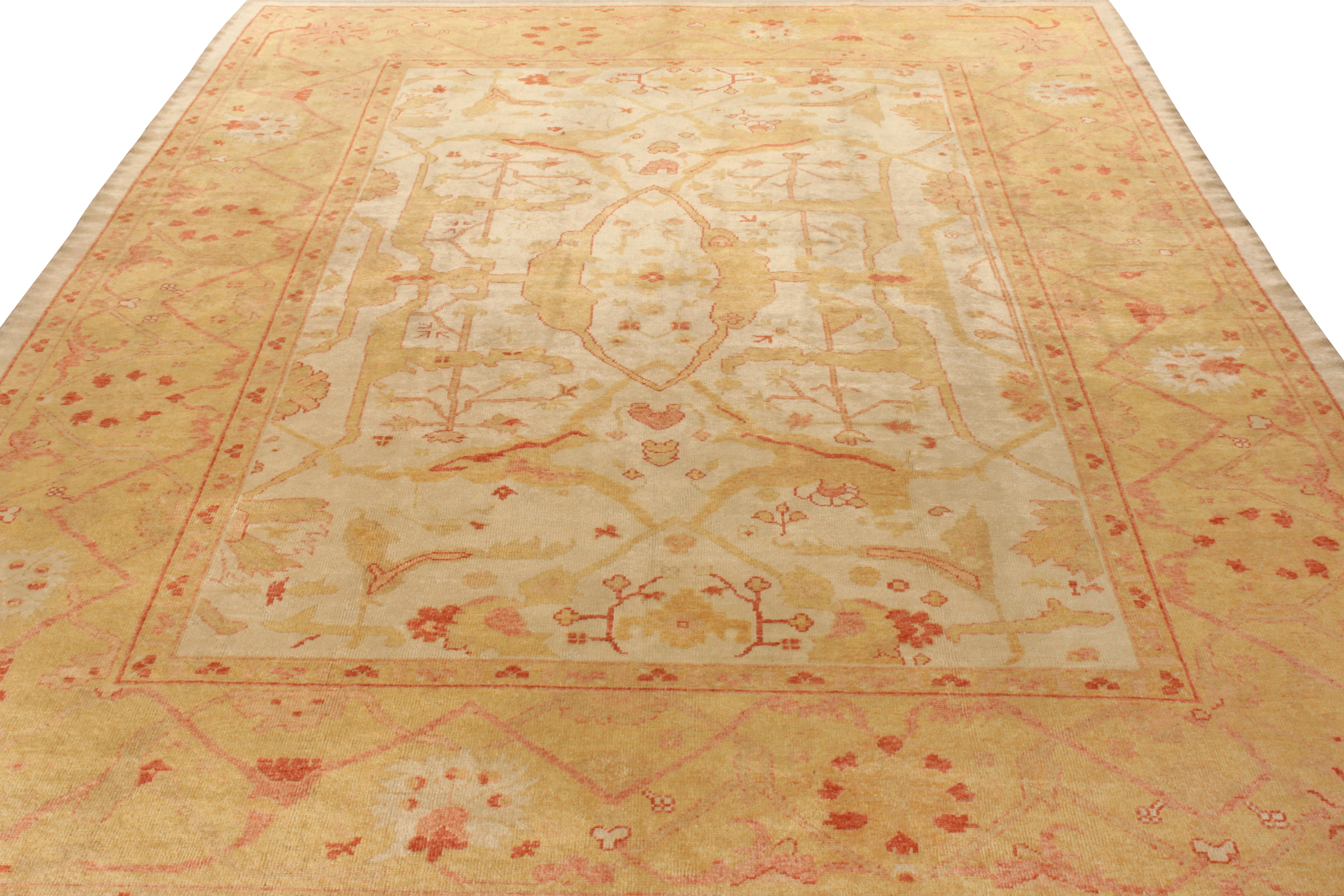 Hand knotted in wool originating from Turkey circa 1950-1960, this 10x13 vintage rug is a notably regal Oushak rug of rare color, exceptional scale, and elegant movement. Embodying classic rug aesthetics, the rug captures attention with a central