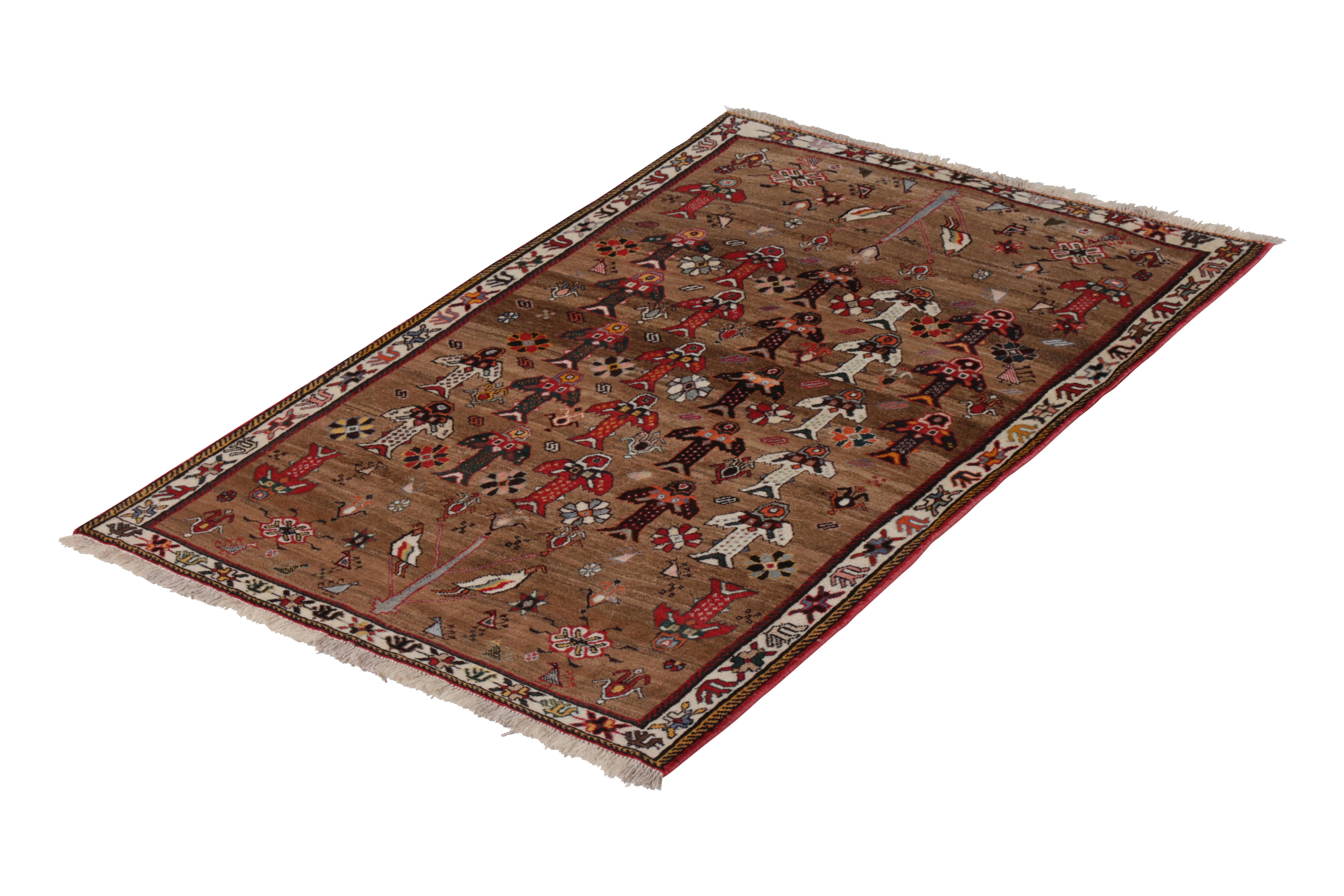 A vintage 4 x 6 Persian rug of Gabbeh tribal design, hand knotted in wool originating circa 1950-1960. Enjoying eccentric geometric patterns against a handsome, abrashed field in rich red and beige-brown hues all over.

On the design: Diverse