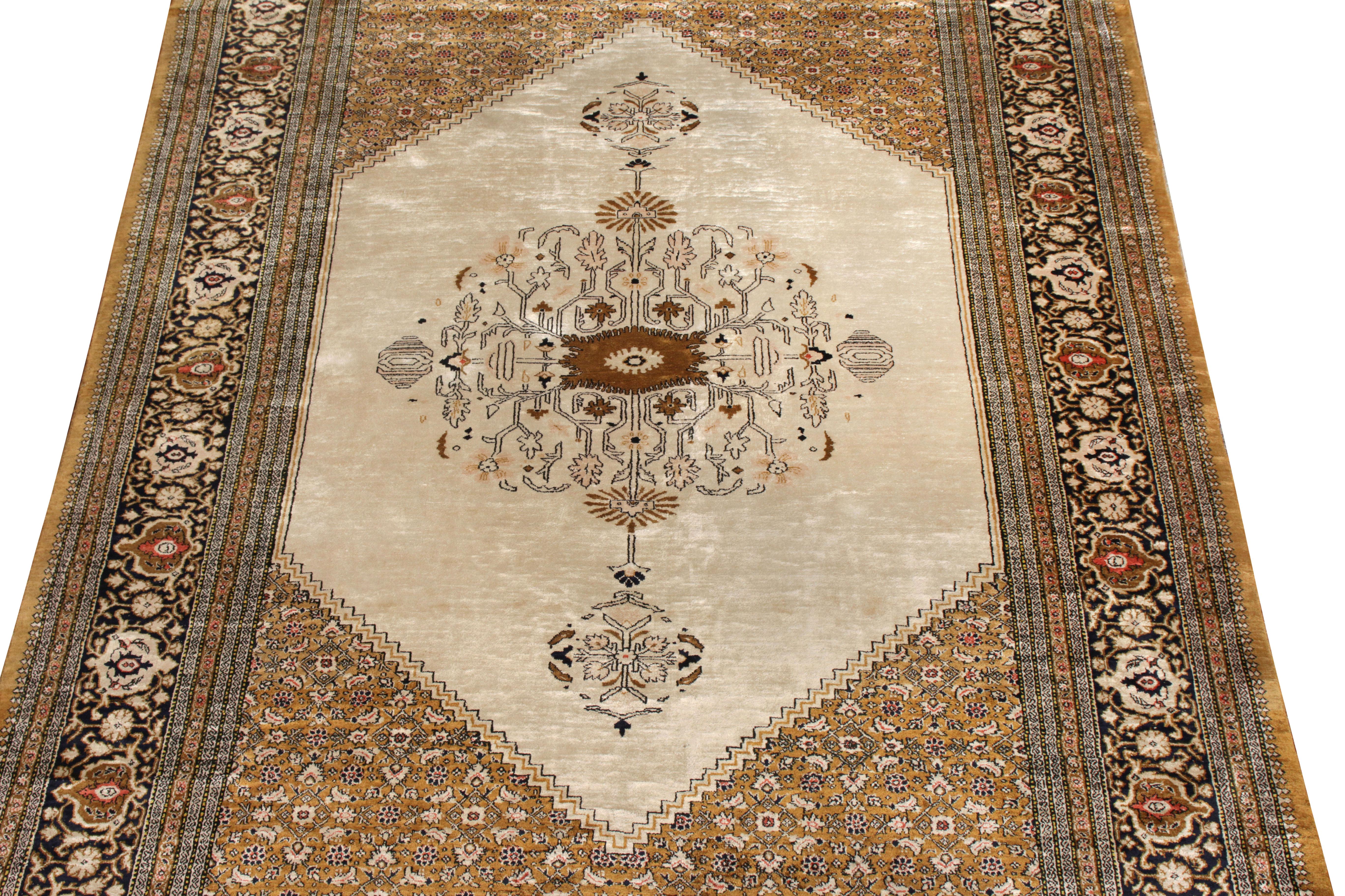 Originating from Persia circa 1950-1960, this vintage Persian rug is a distinct piece of its Qum design lineage with fabulous aesthetics and natural silk composition. The vision of this 4x6 design manifests an attractive beige-brown in medallion