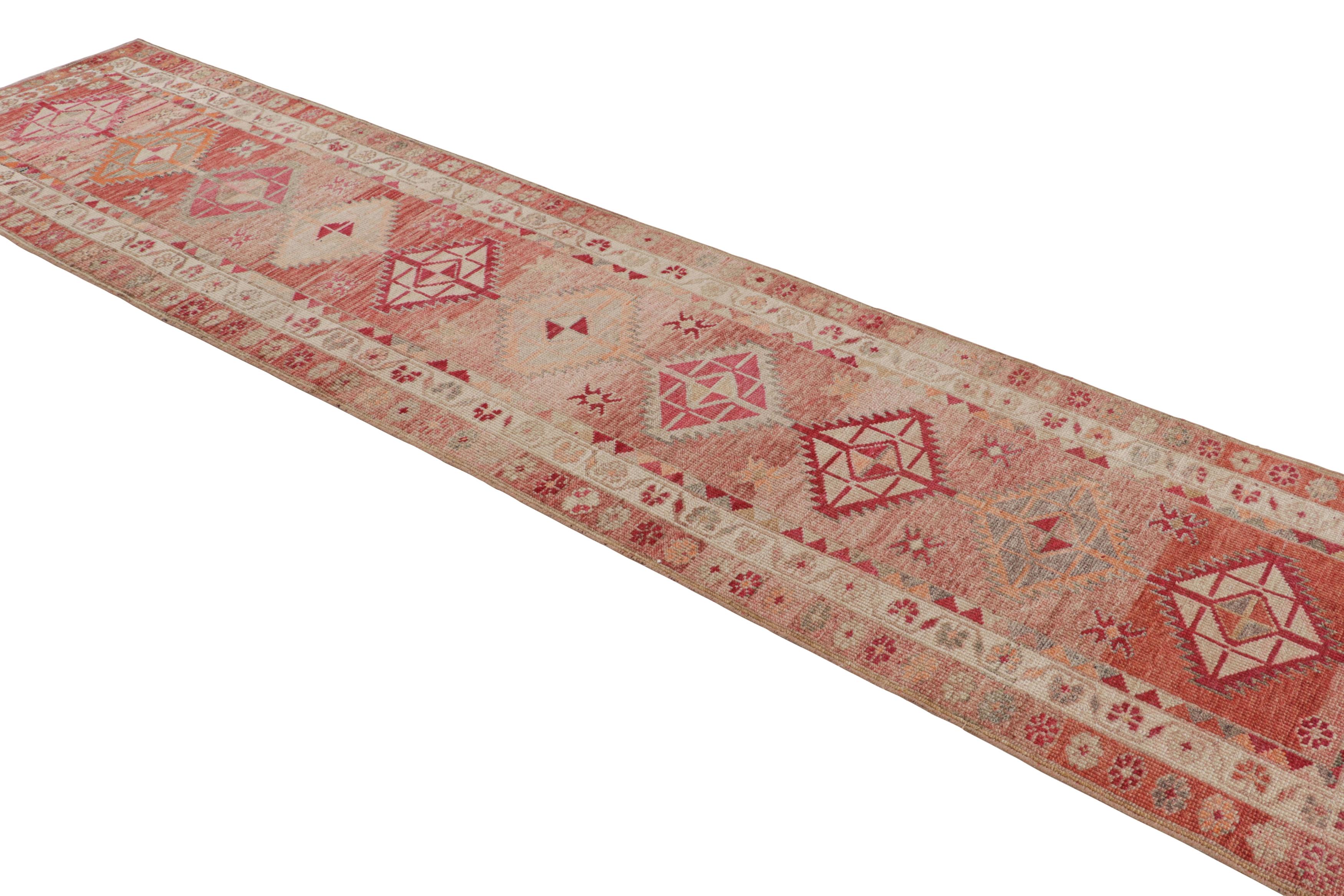 Turkish Hand-Knotted Vintage Runner, Red-Pink Rug in Geometric Pattern by Rug & Kilim For Sale