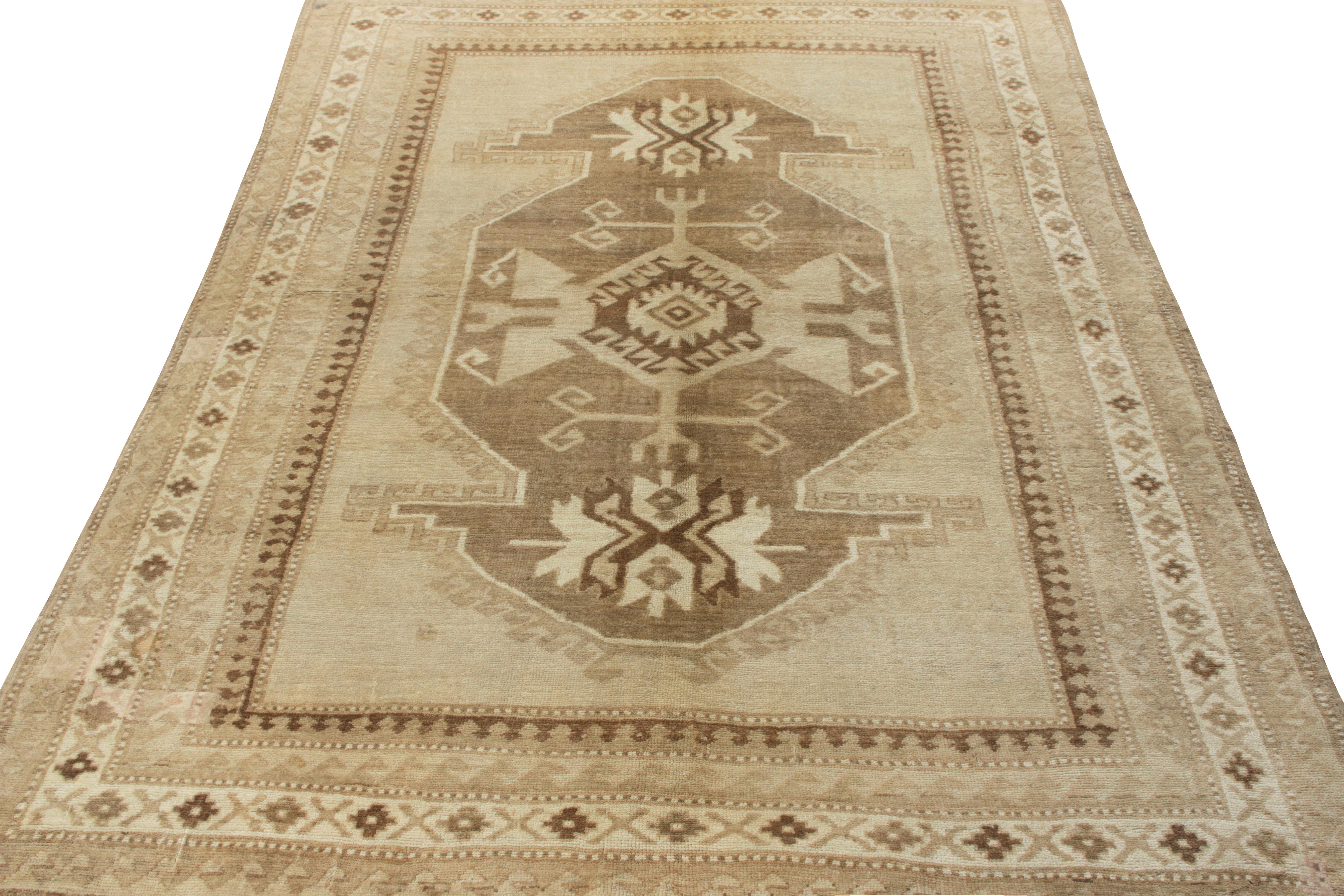 Hand-knotted in wool, a vintage mid-century Kars pile rug originating from Turkey circa 1950-1960. Joining Rug & Kilim’s coveted Antique & Vintage collection, this 7x9 piece exhibits a medallion pattern in tribal style emanating the richness of the
