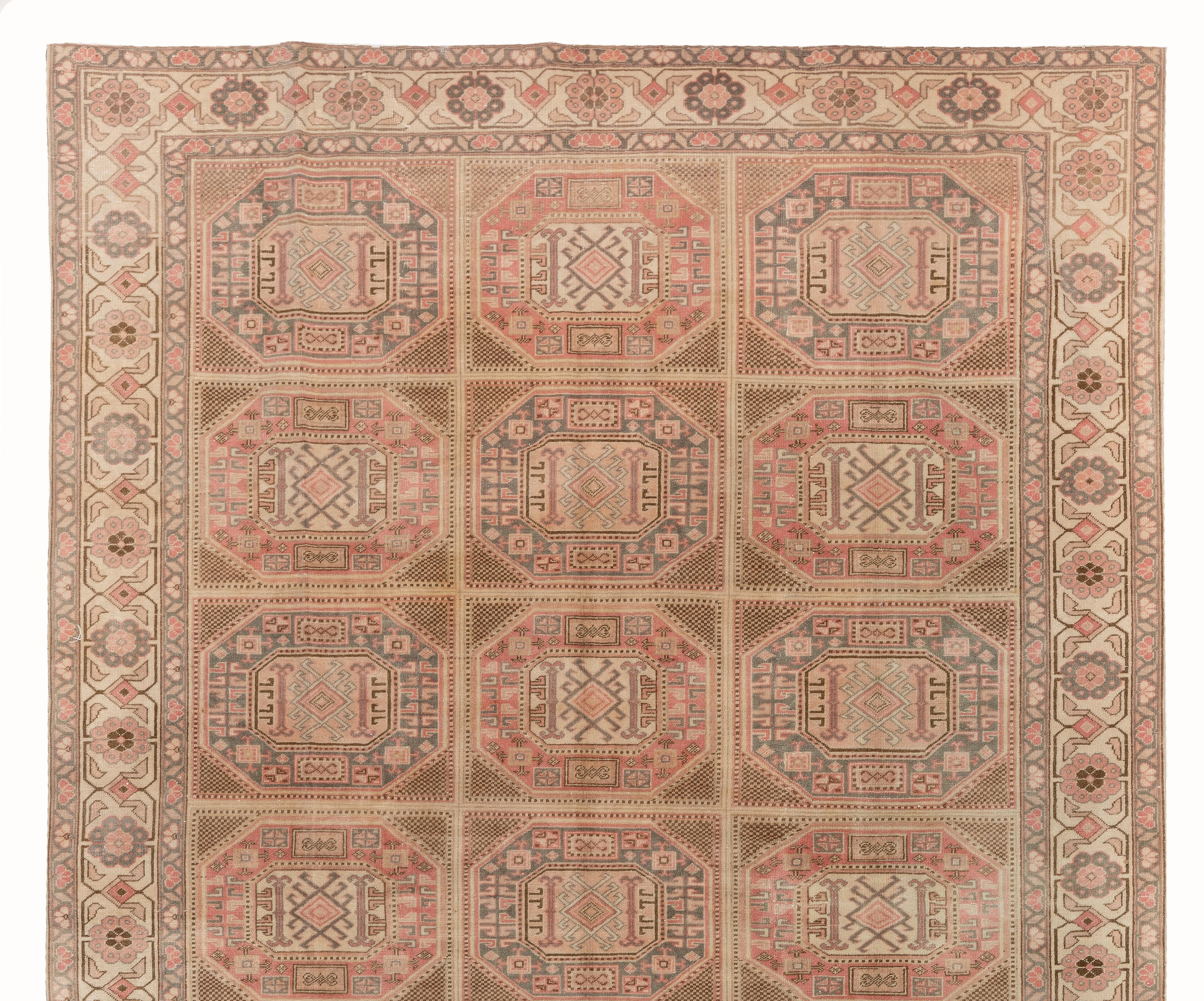 A finely hand knotted rug from the town of Kayseri in Central Anatolia with soft muted colors and well drawn geometric design with tribal patterns. Measures: 6.8 x 9.8 ft.
Soft medium wool pile on cotton foundation.
The rug is washed