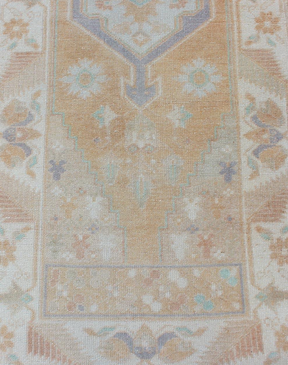 20th Century Hand Knotted Vintage Turkish Oushak Runner with Medallion Design in Soft Peach For Sale