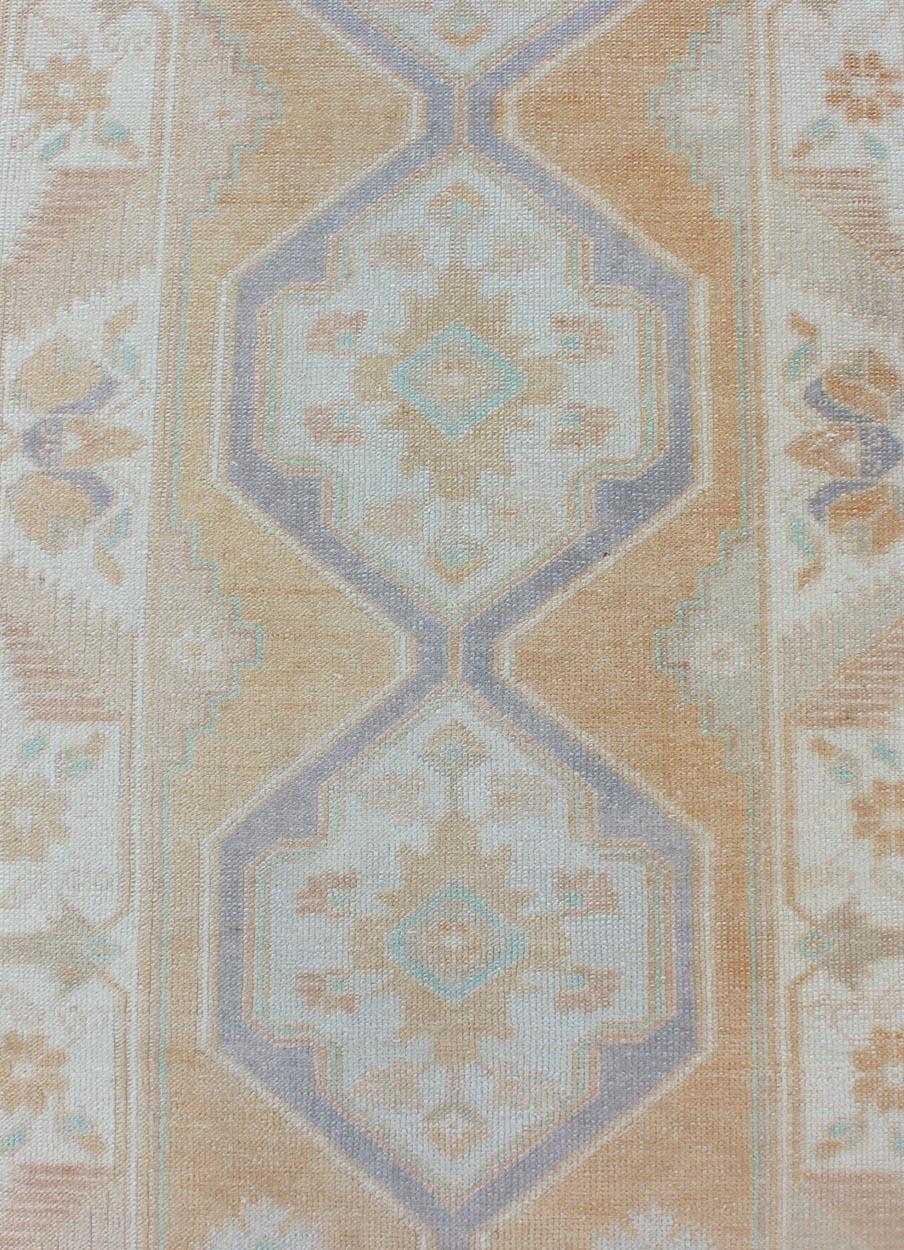 Wool Hand Knotted Vintage Turkish Oushak Runner with Medallion Design in Soft Peach For Sale