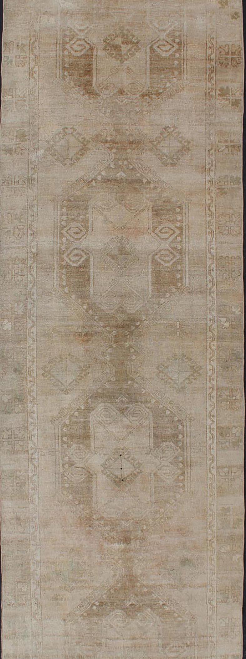 Hand-Knotted Hand Knotted Vintage Turkish Runner in Earth Tones & Light Brown in Medallions For Sale