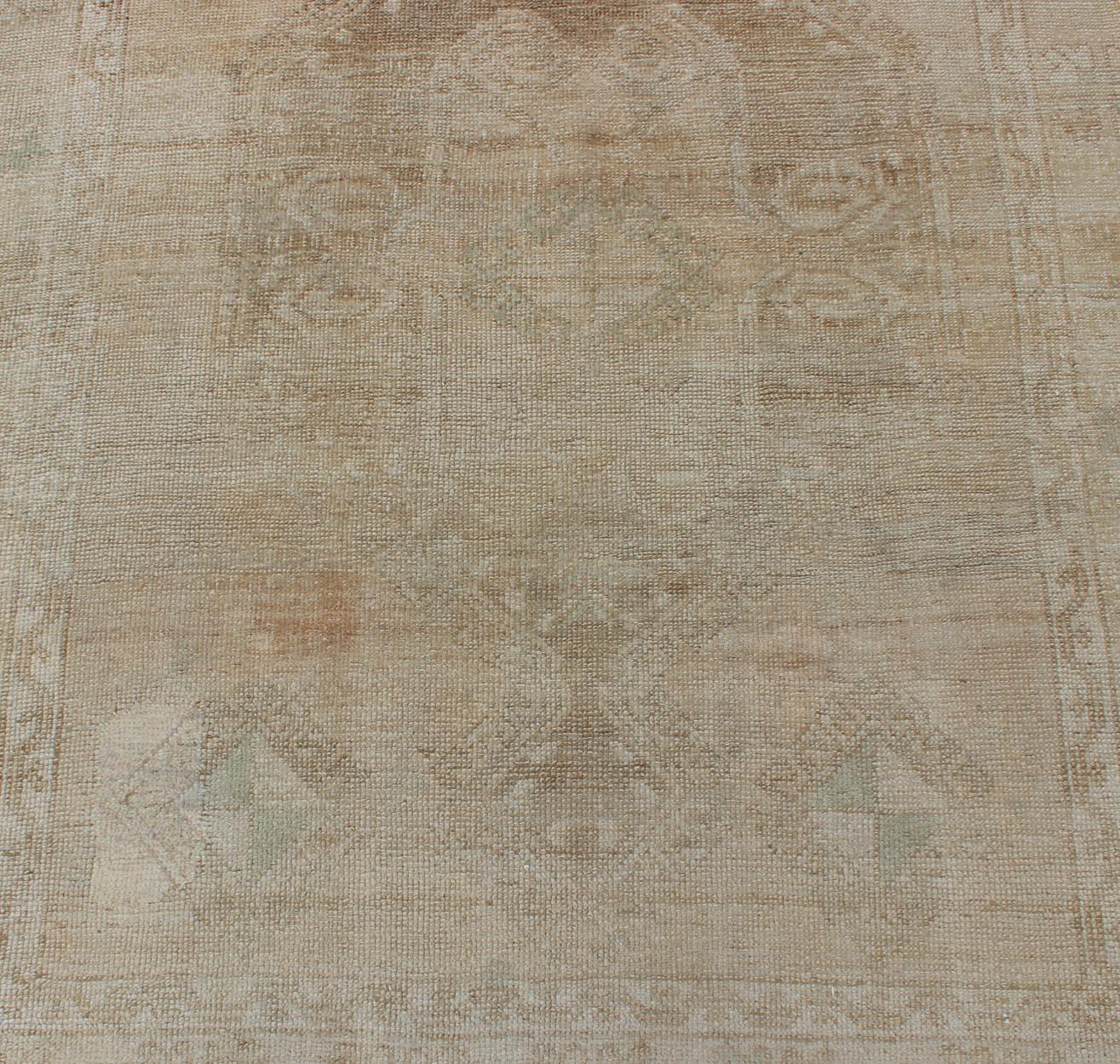 Wool Hand Knotted Vintage Turkish Runner in Earth Tones & Light Brown in Medallions For Sale