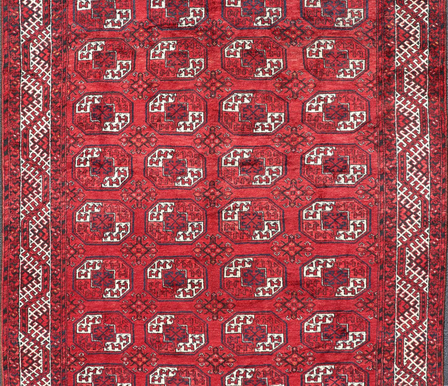 Hand-Knotted Vintage Turkomen Ersari Rug in Wool with Repeating Gul Design In Excellent Condition For Sale In Atlanta, GA