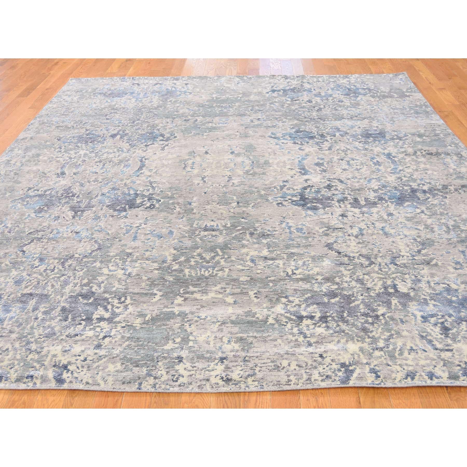 This is a truly genuine one-of-a-kind hand knotted wool and silk abstract design Oriental rug. It has been knotted for months and months in the centuries-old Persian weaving craftsmanship techniques by expert artisans. Measures: 8'1