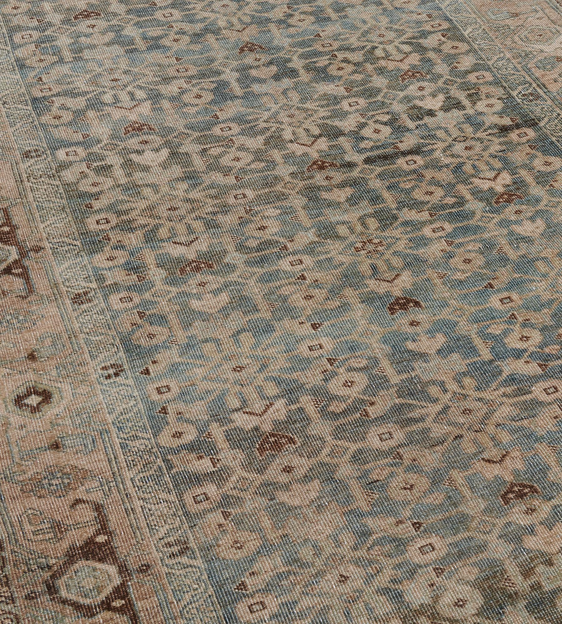 This antique Persian Bidjar Runner has a sea-blue field with an overall buff-brown and chocolate-brown herati-pattern, in a buff-brown border of angular chocolate-brown and ivory turtle-palmette and angular vine between chocolate-brown and ivory