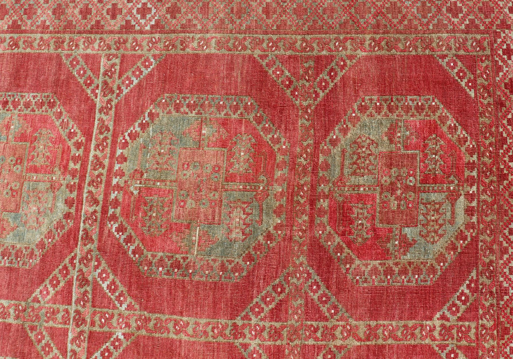 Tribal Hand-Knotted Wool Ersari Rug in Wool with Gul Design in Shades of Red & Green