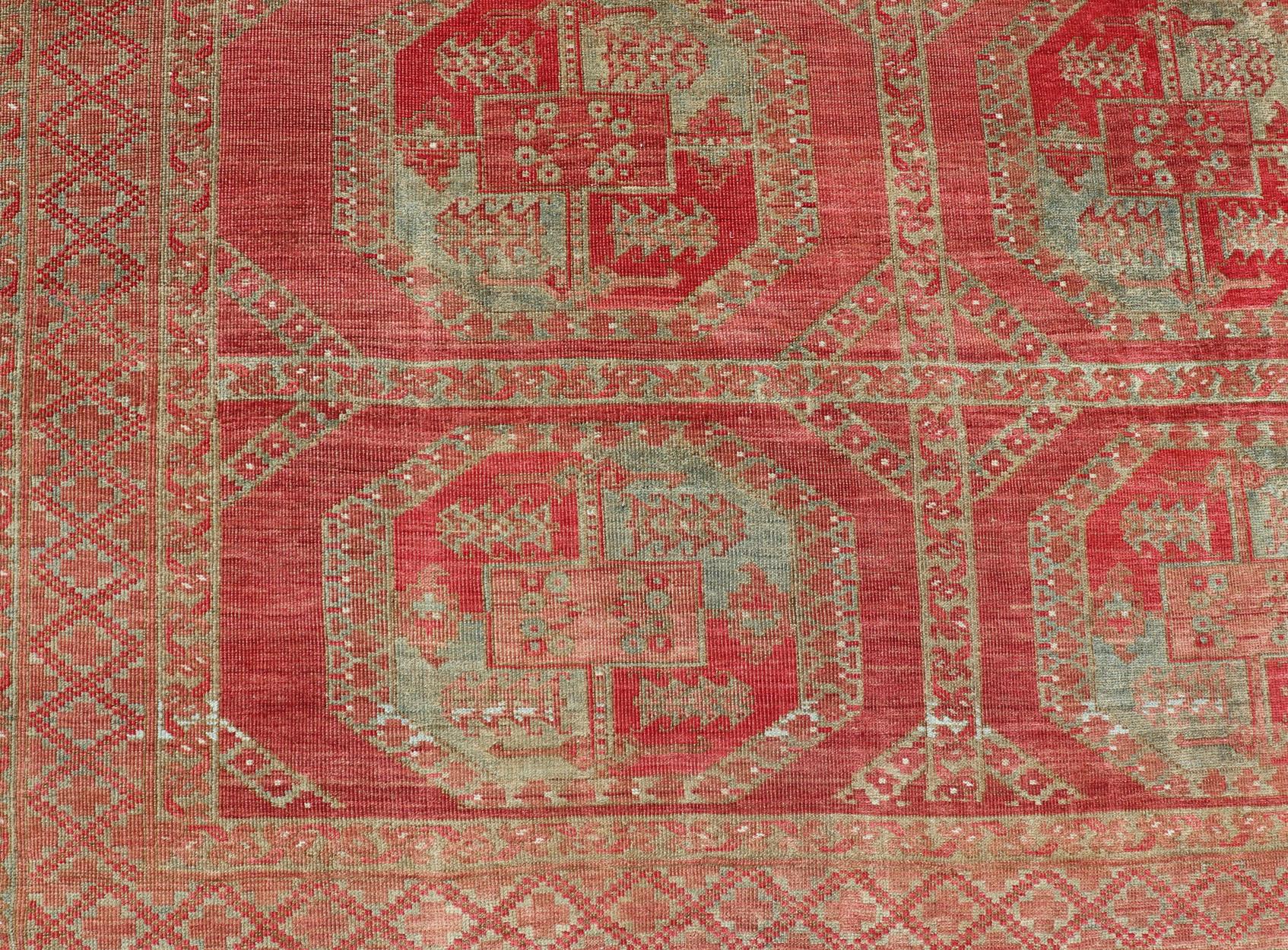 Turkestan Hand-Knotted Wool Ersari Rug in Wool with Gul Design in Shades of Red & Green