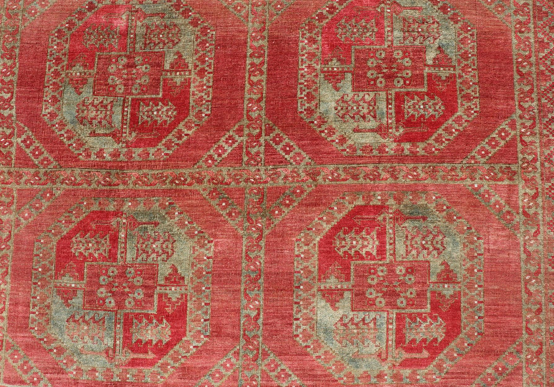 Hand-Carved Hand-Knotted Wool Ersari Rug in Wool with Gul Design in Shades of Red & Green