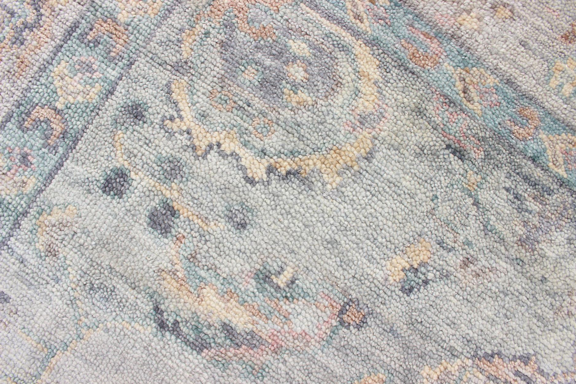 Indian Hand Knotted Wool Oushak Rug Featuring Floral Designs in Muted Colors 7'8
