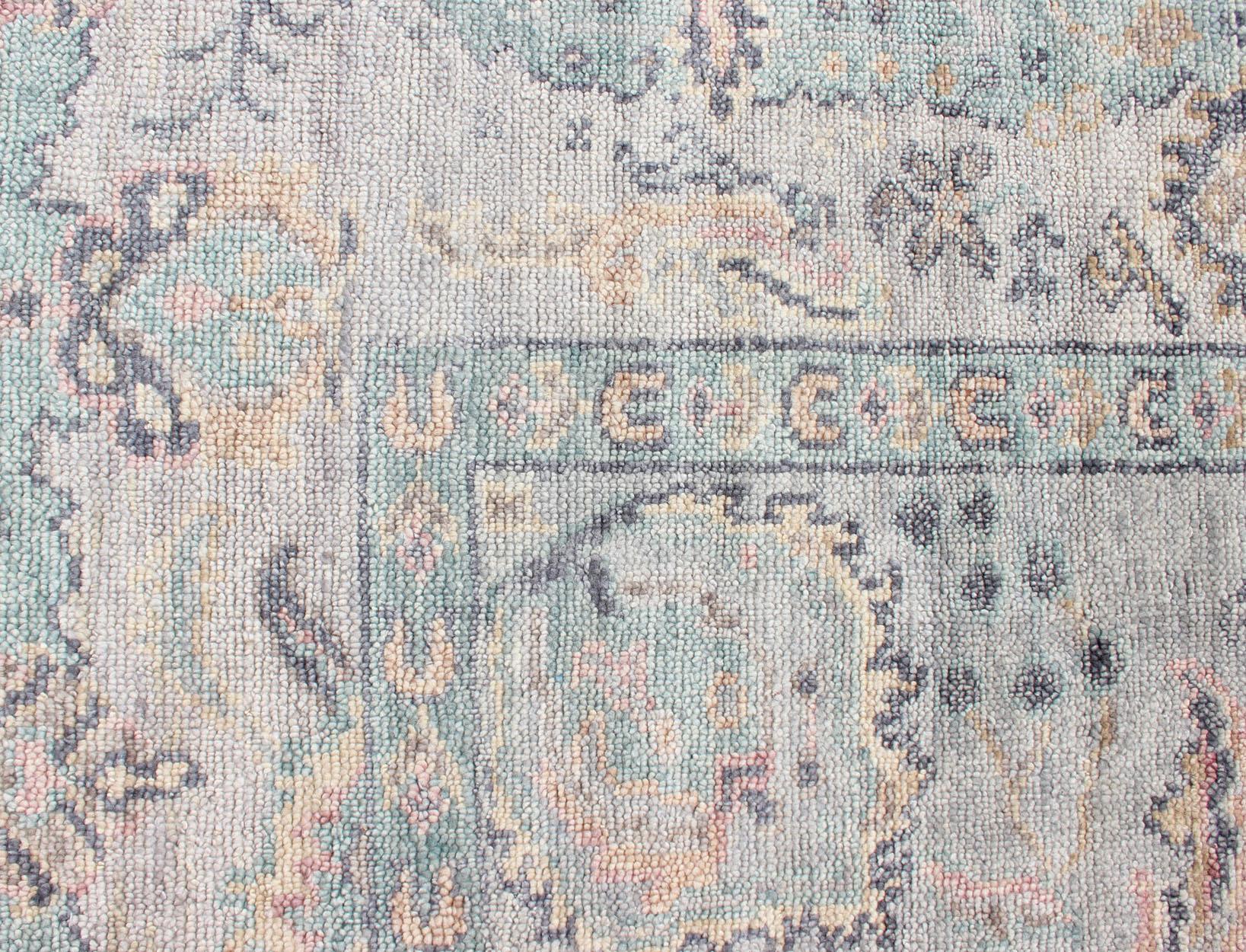 Hand-Knotted Hand Knotted Wool Oushak Rug Featuring Floral Designs in Muted Colors 7'8