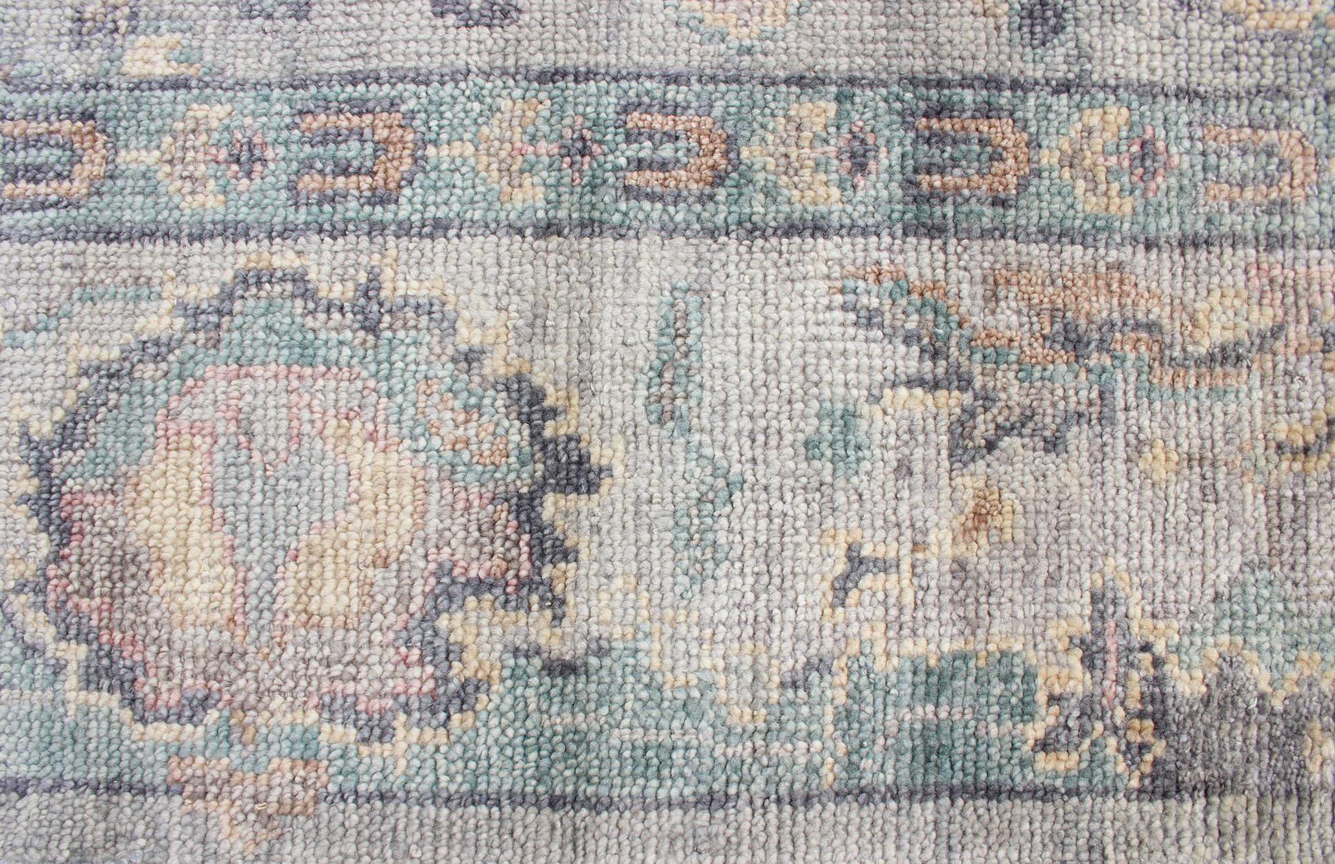 Contemporary Hand Knotted Wool Oushak Rug Featuring Floral Designs in Muted Colors 7'8